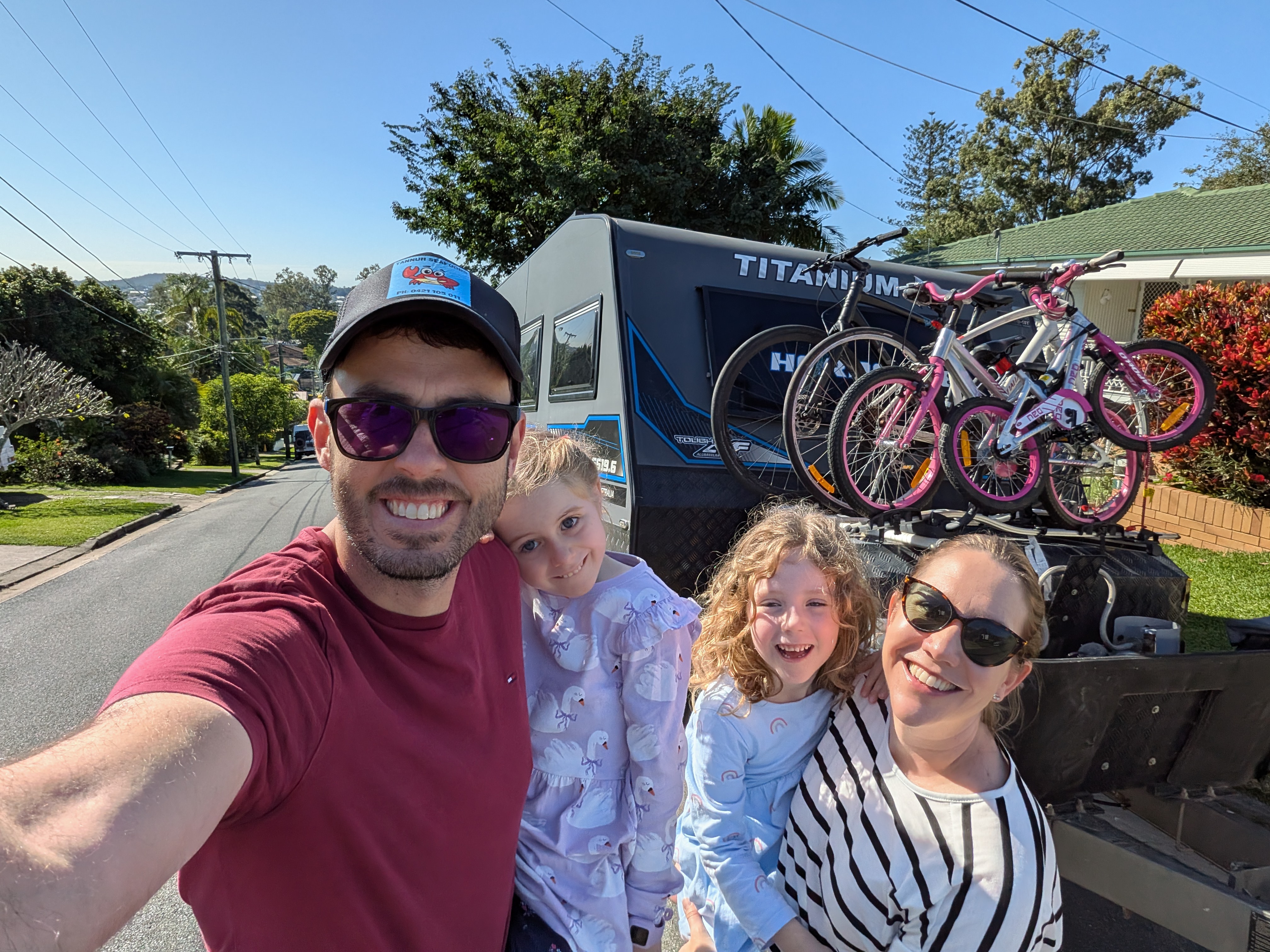 Family selfie in front of TITANIUM HARDCORE on departure day