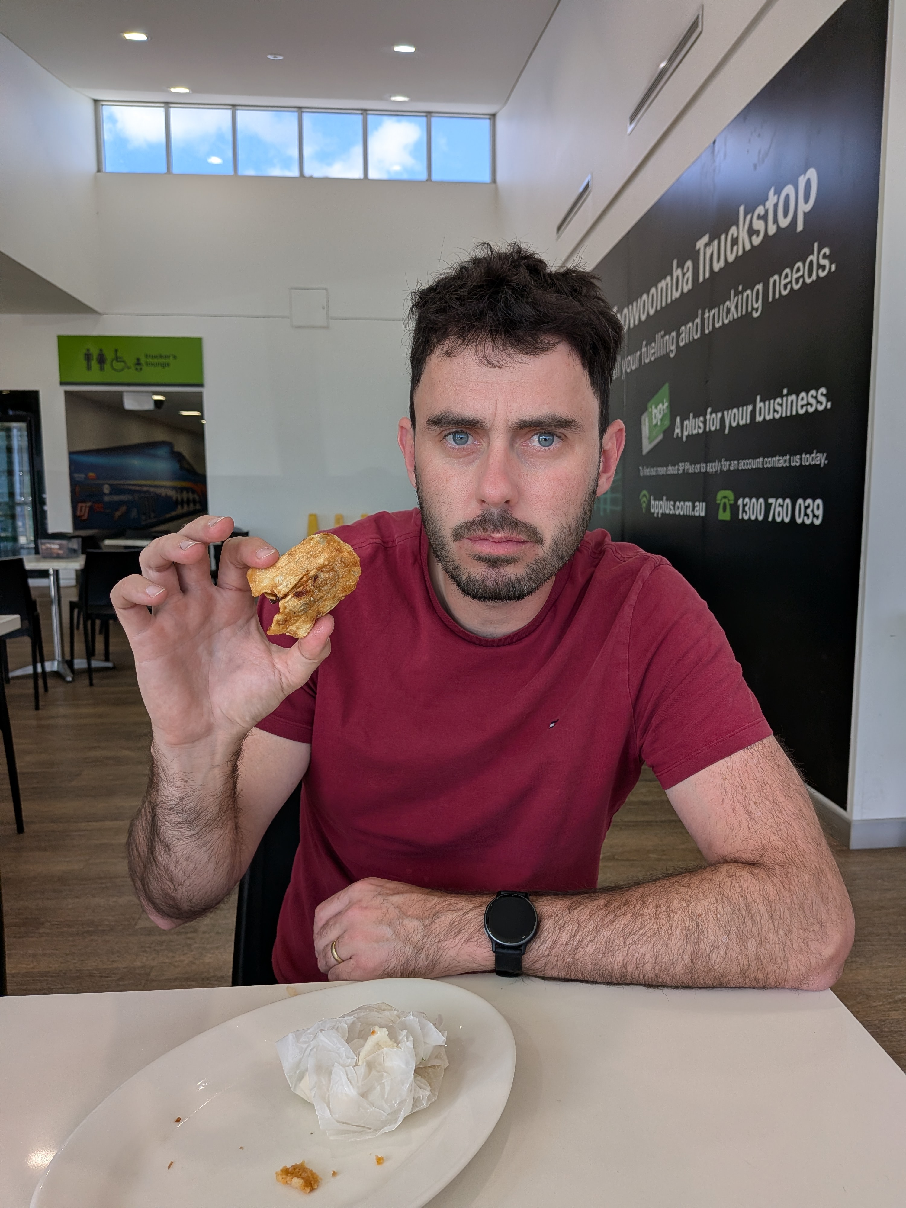 Dylan with his first dim sim at the Toowoomba Truckstop
