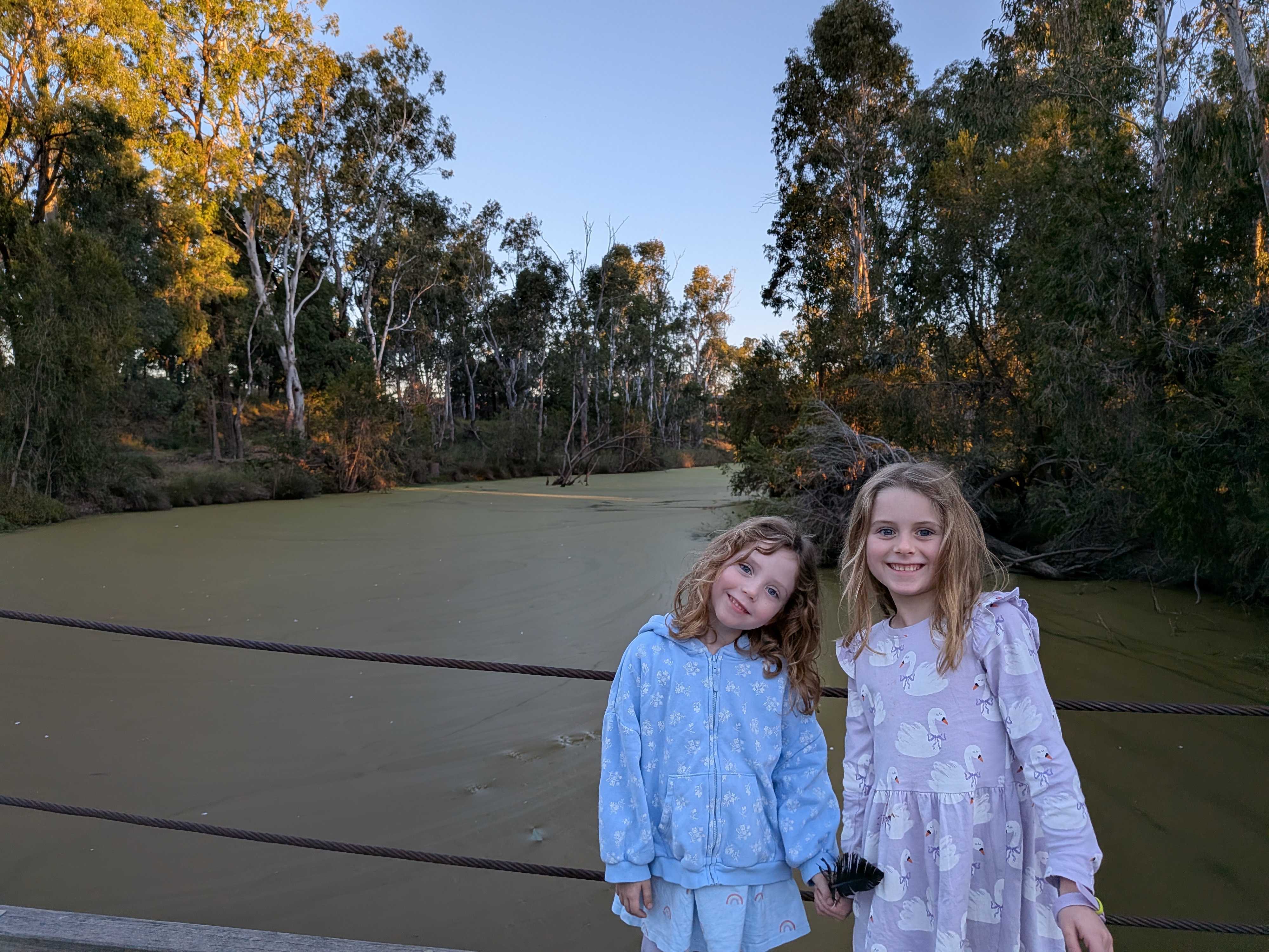 The girls by the green creek at Miles