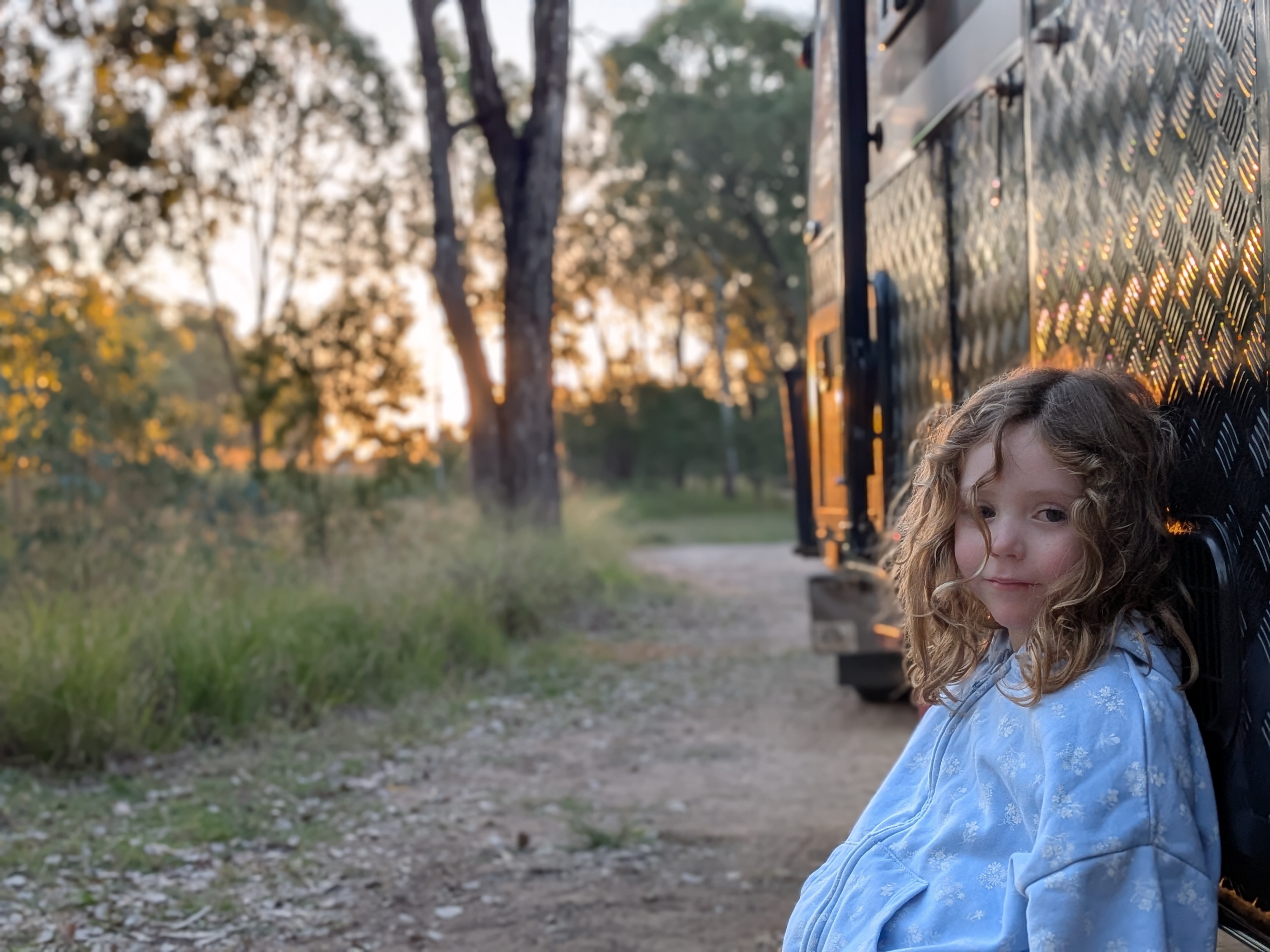 Leah by the caravan at golden hour