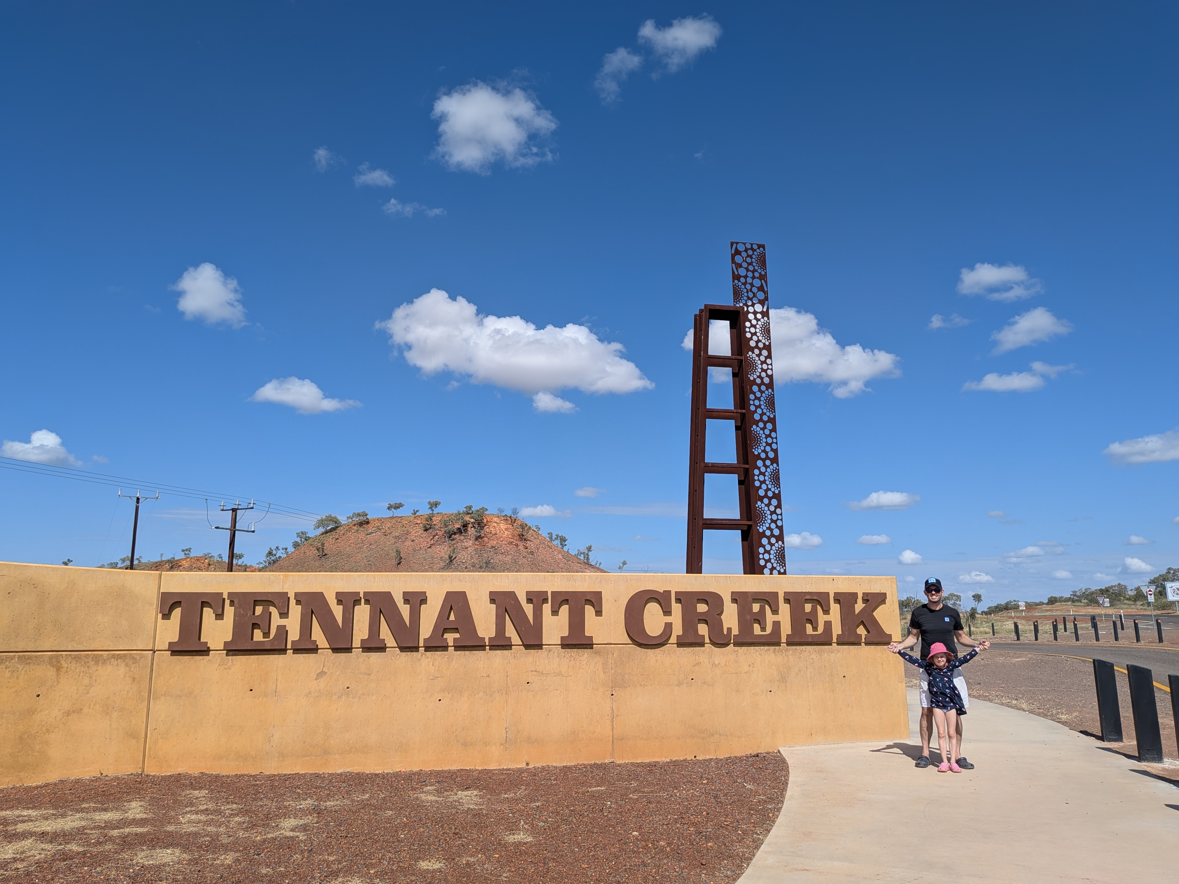 Dylan and Leah at the Tennant Creek sign