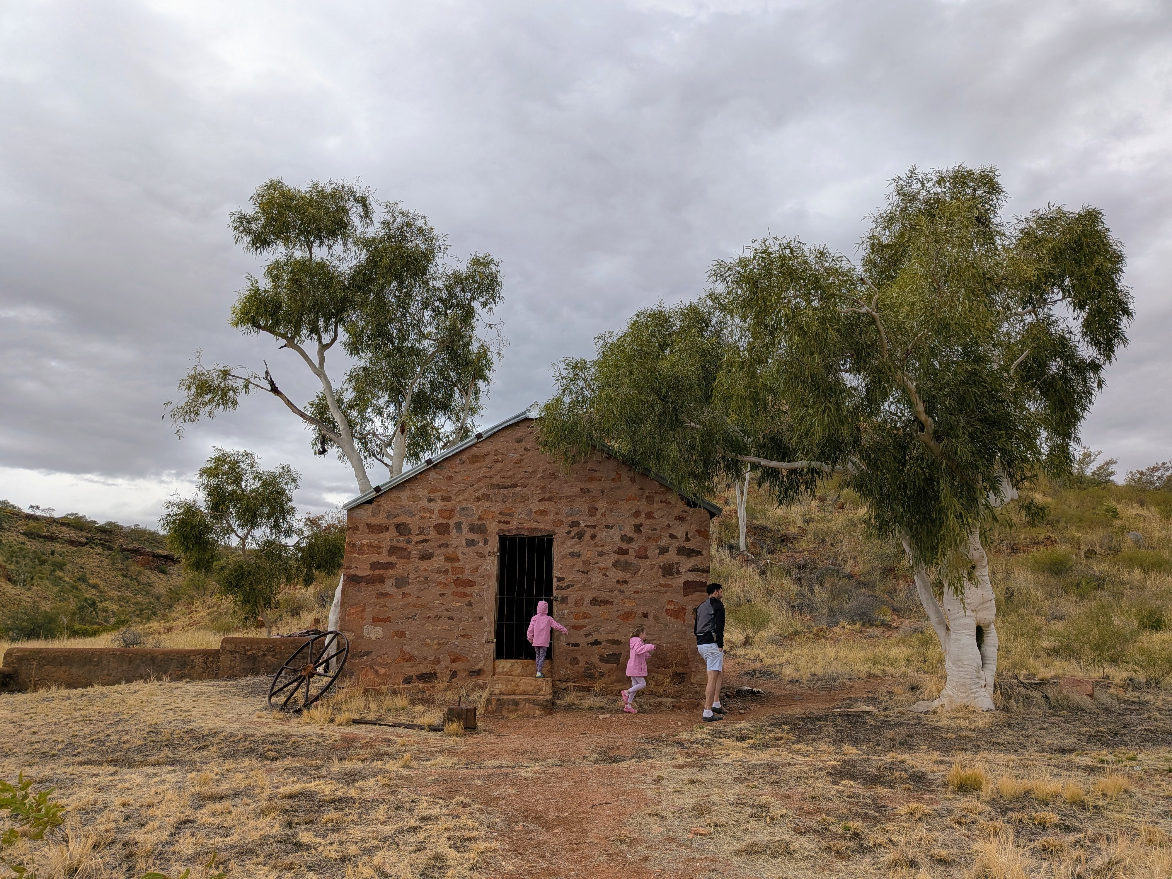 Dylan and the girls exploring the stone outbuilding at the Telegraph Station