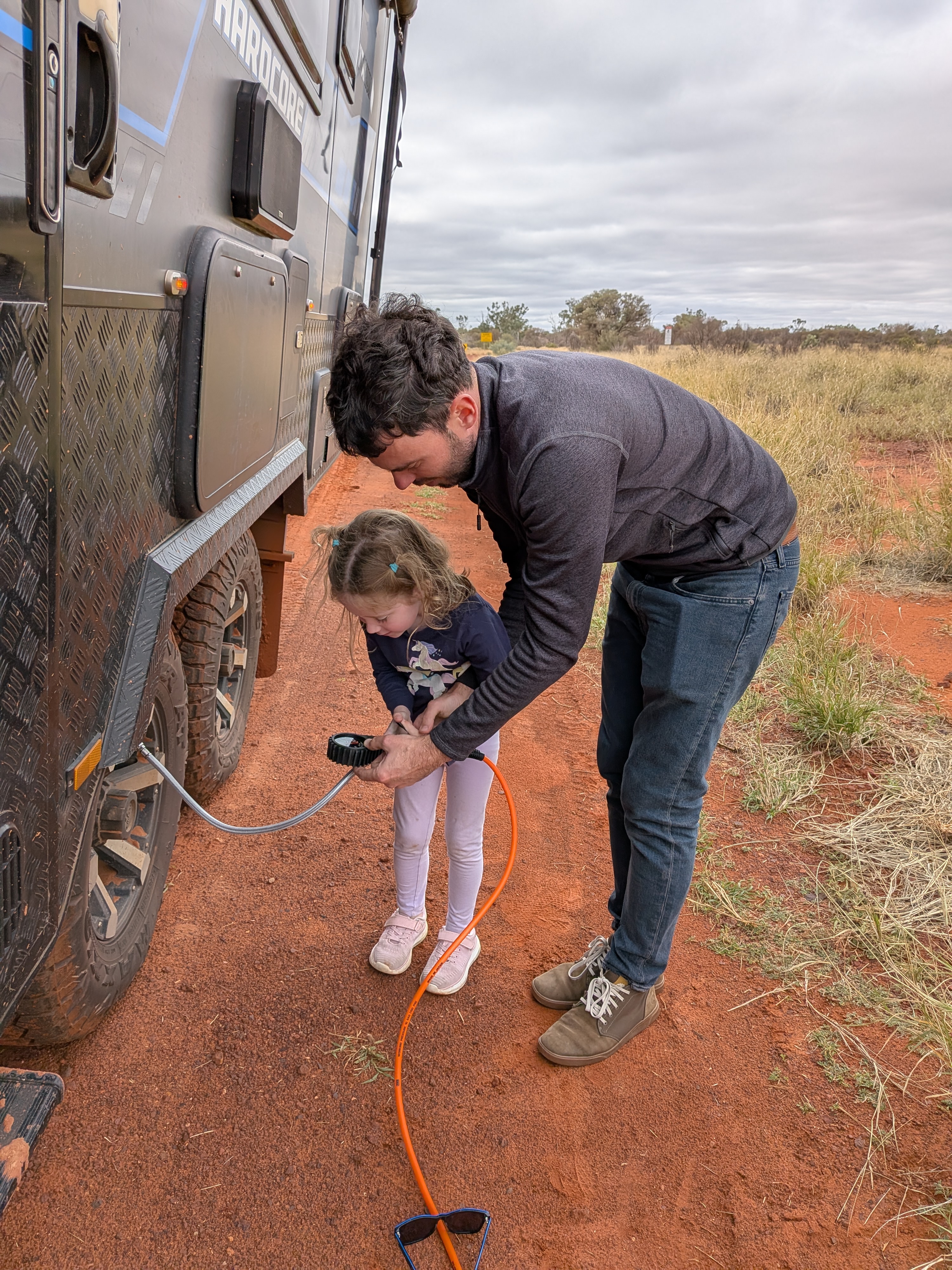 Dylan and Leah airing up the tyres on the red dirt
