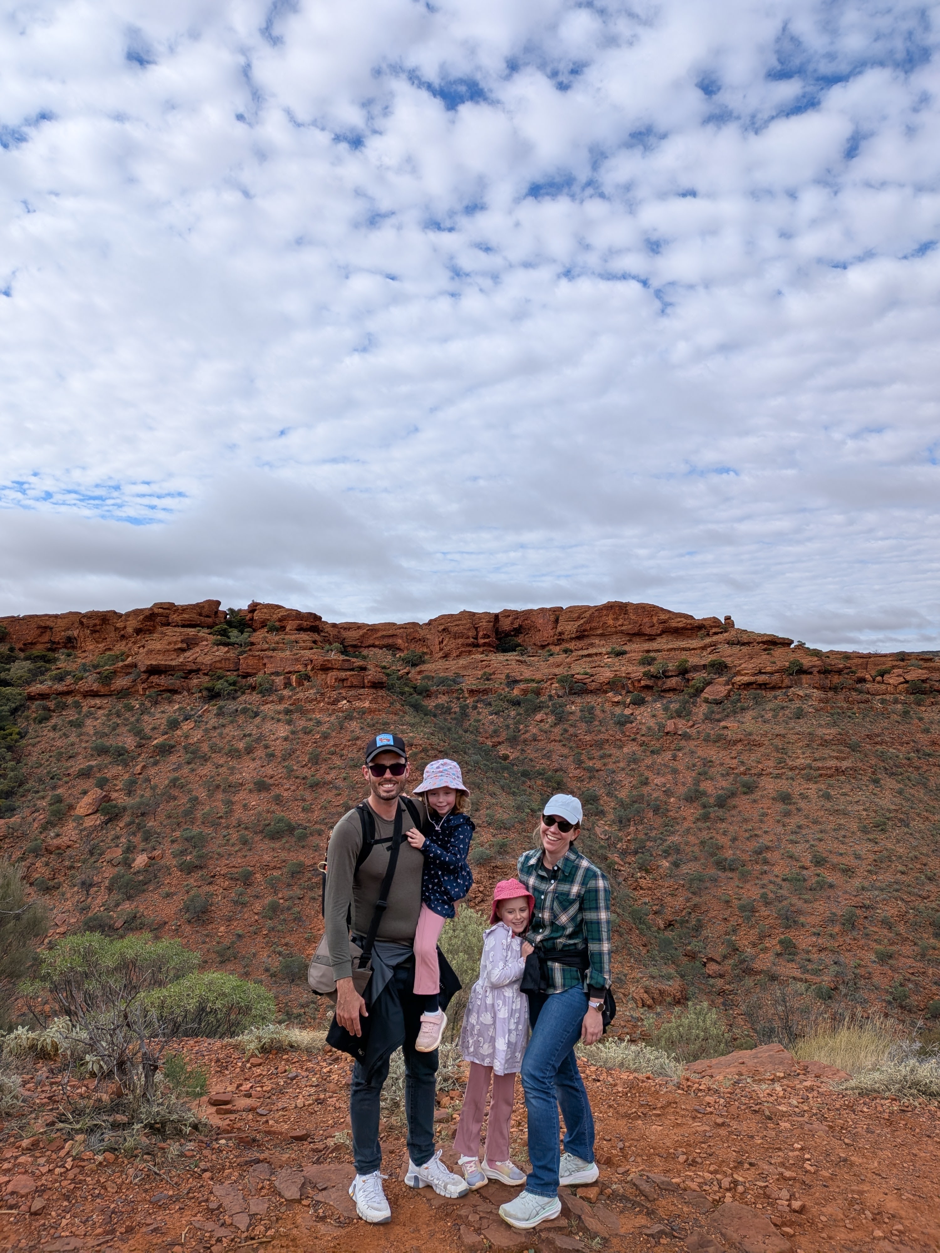 Family photo at the top of Kings Canyon with the red rim behind