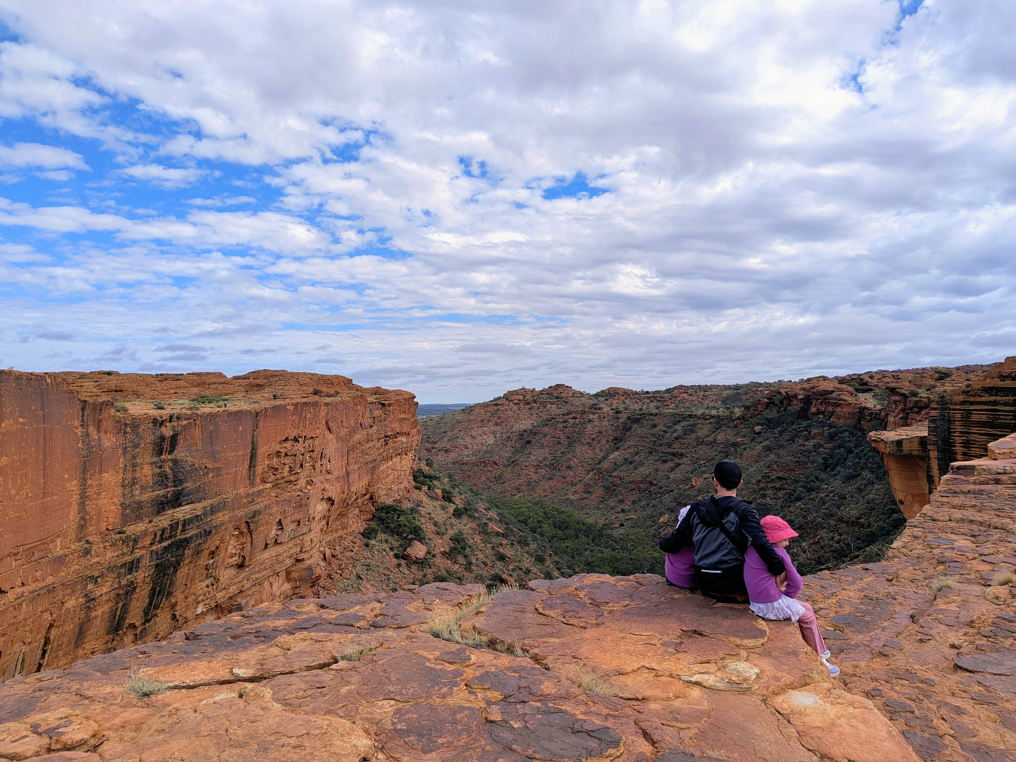 Dylan sitting on the edge of Kings Canyon looking out over the gorge