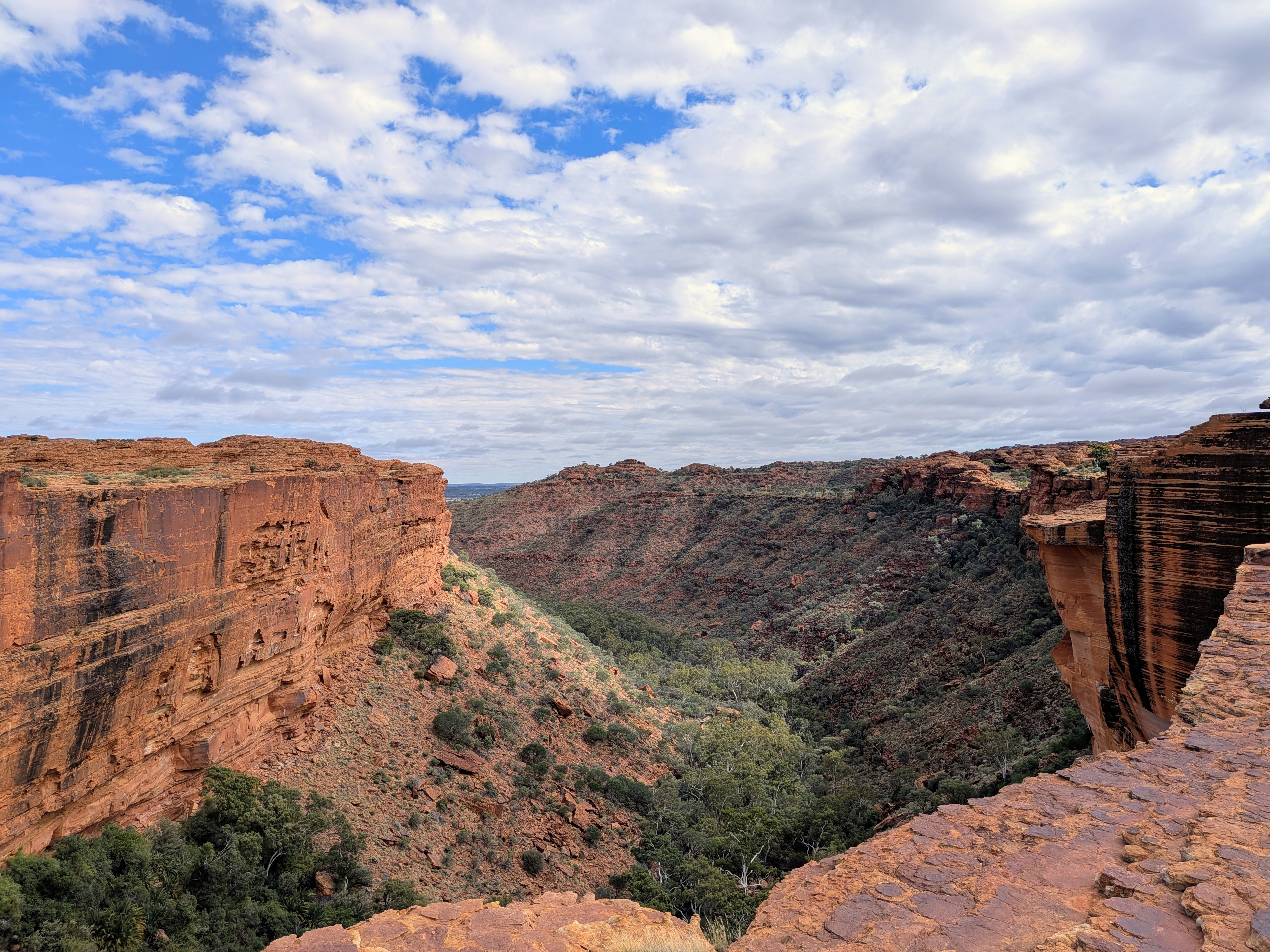 Kings Canyon landscape — sheer cliff faces and green valley below