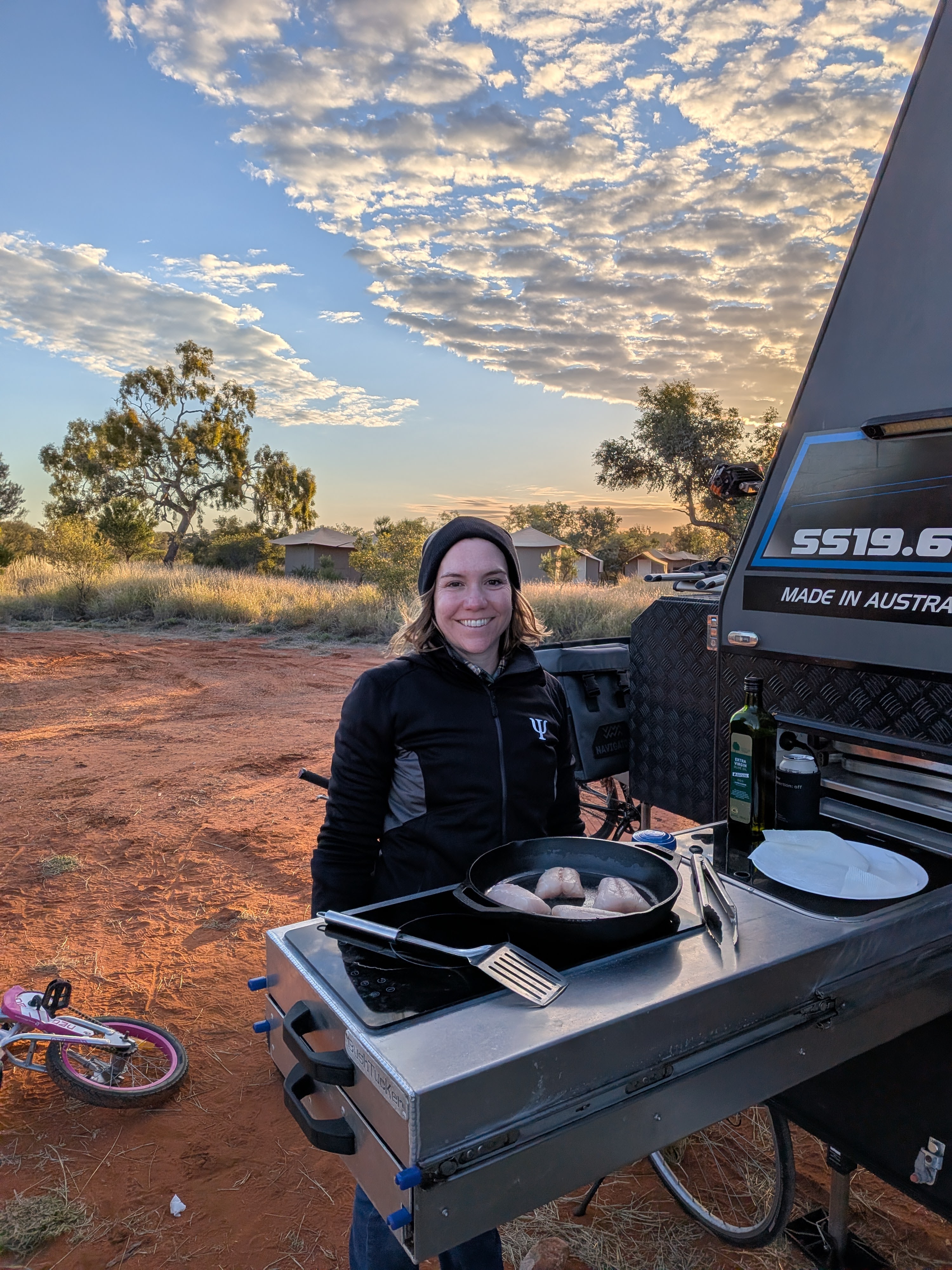 Erin cooking dinner at sunset by TITANIUM HARDCORE at Kings Creek