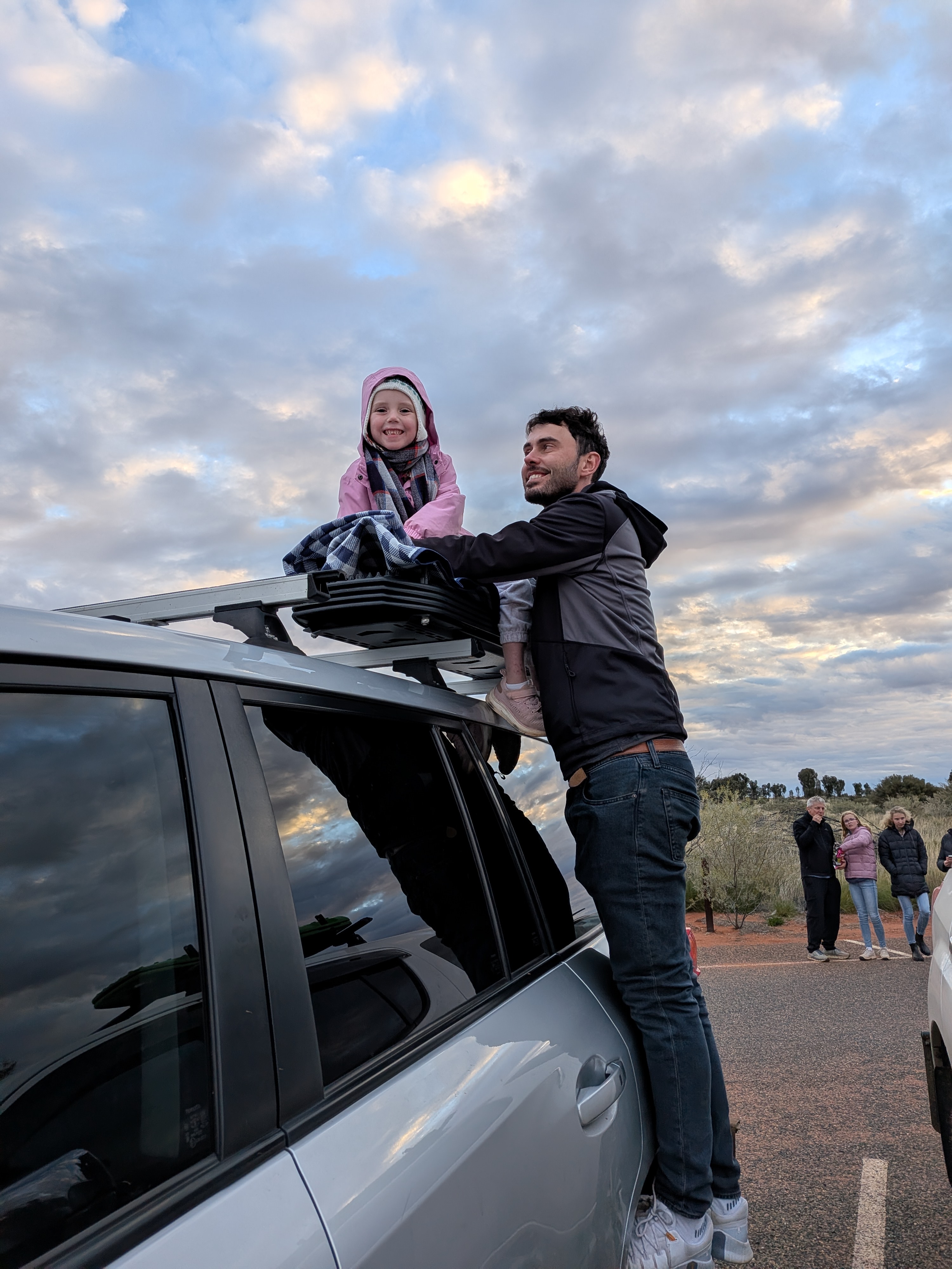Dylan and Leah on the roof rack at the Uluru sunset viewing