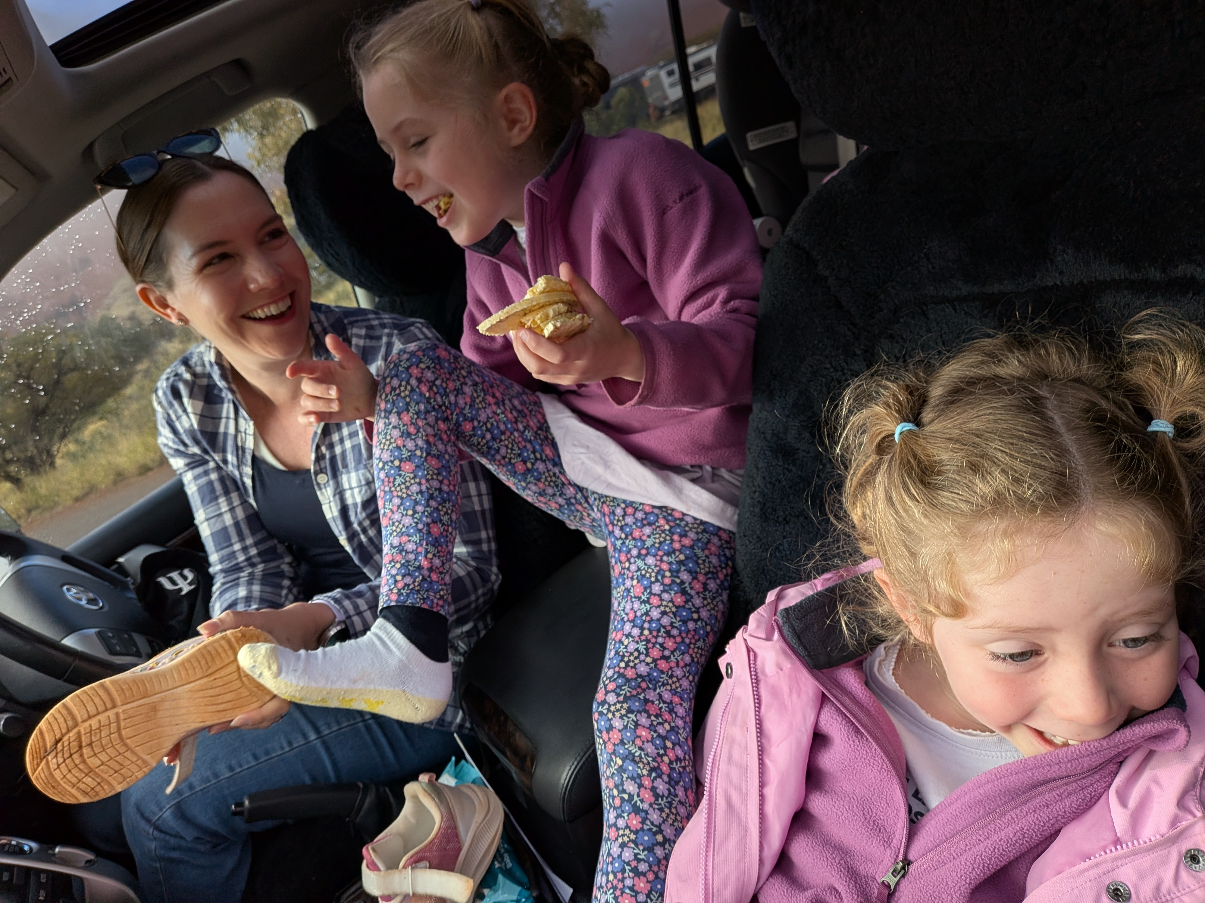 Erin and the girls laughing in the car on the way to Kata Tjuta