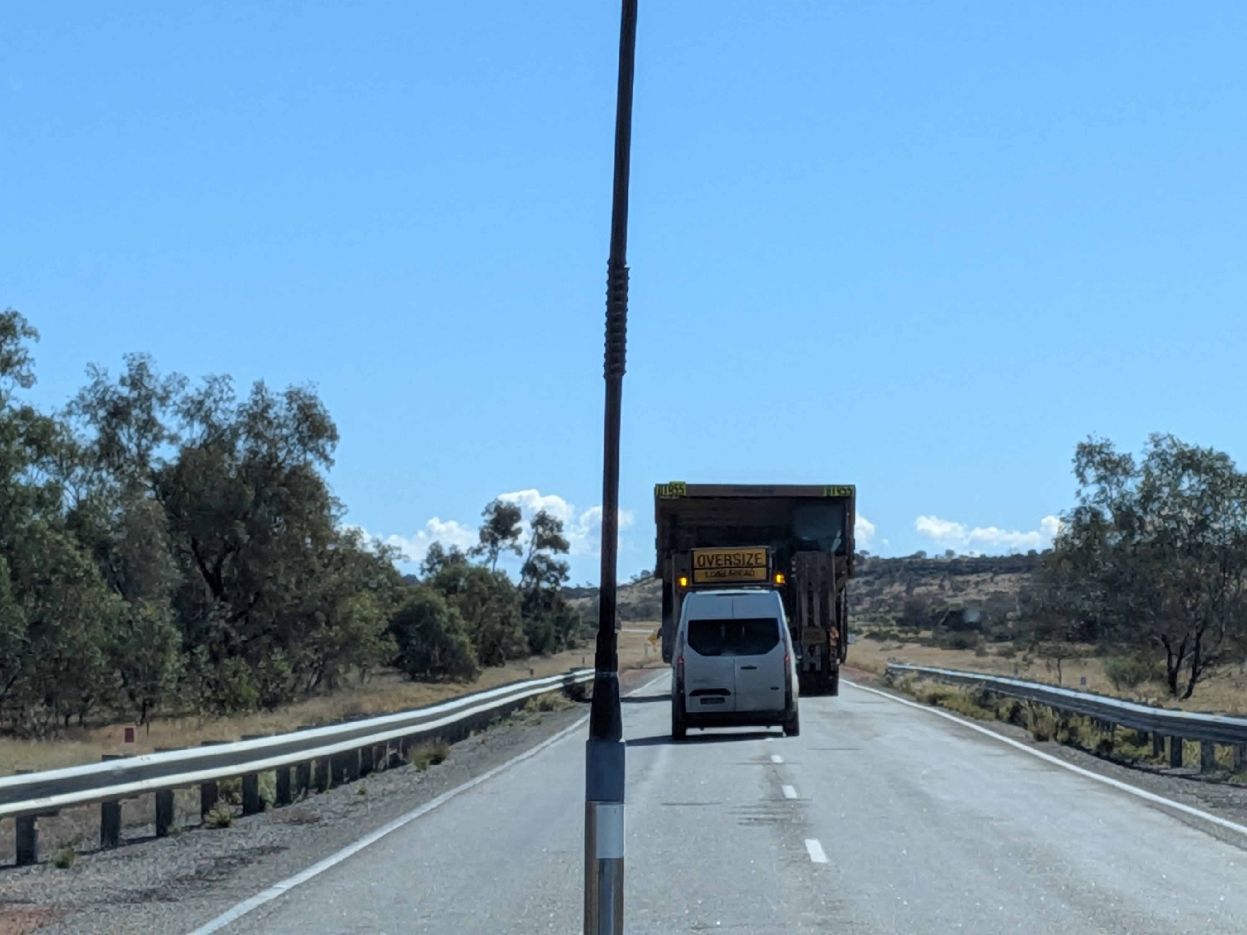 Stuck behind an enormous oversize mining truck on the road to Alice Springs