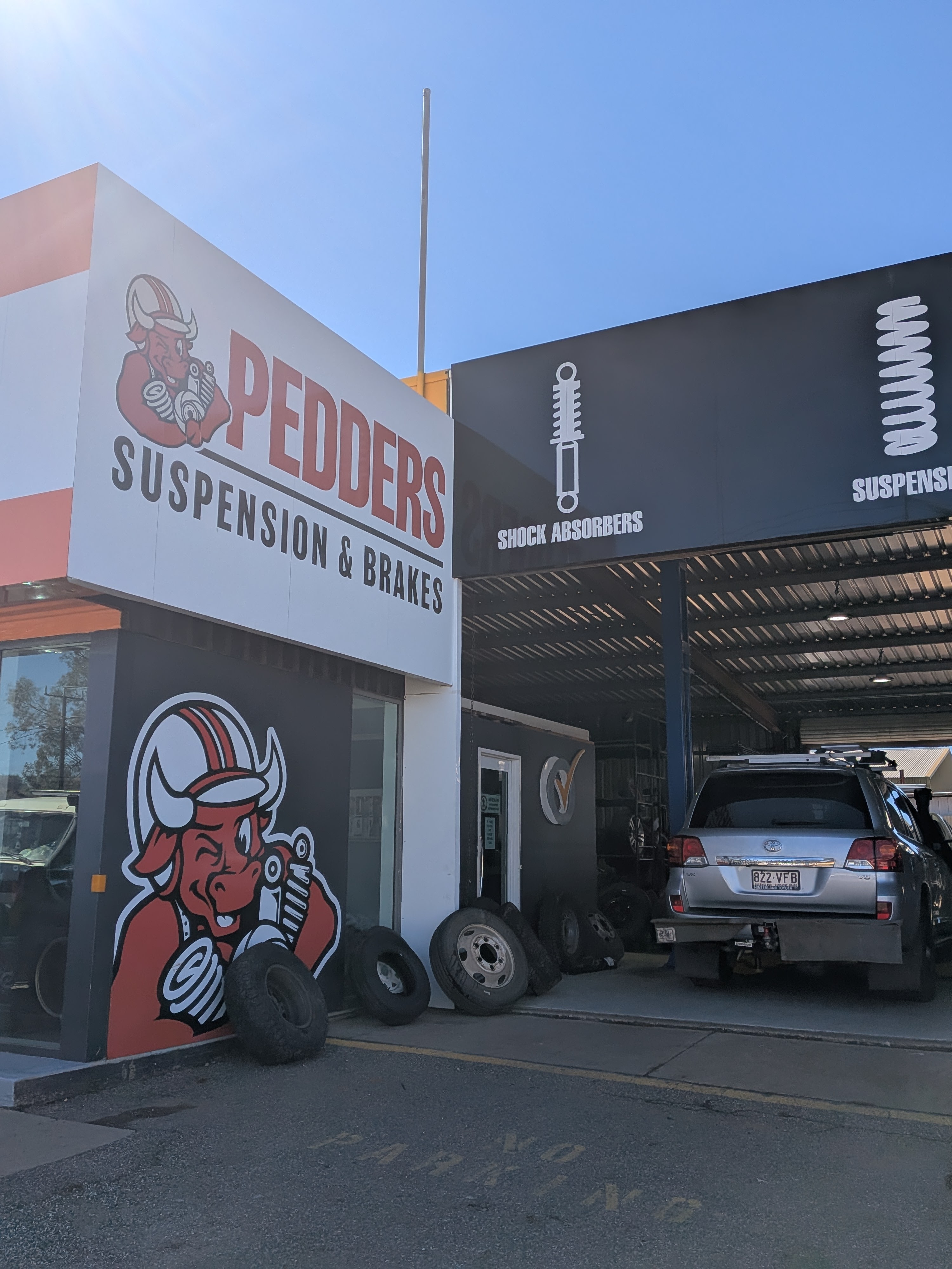 The car at Pedders Suspension and Brakes in Alice Springs for its service