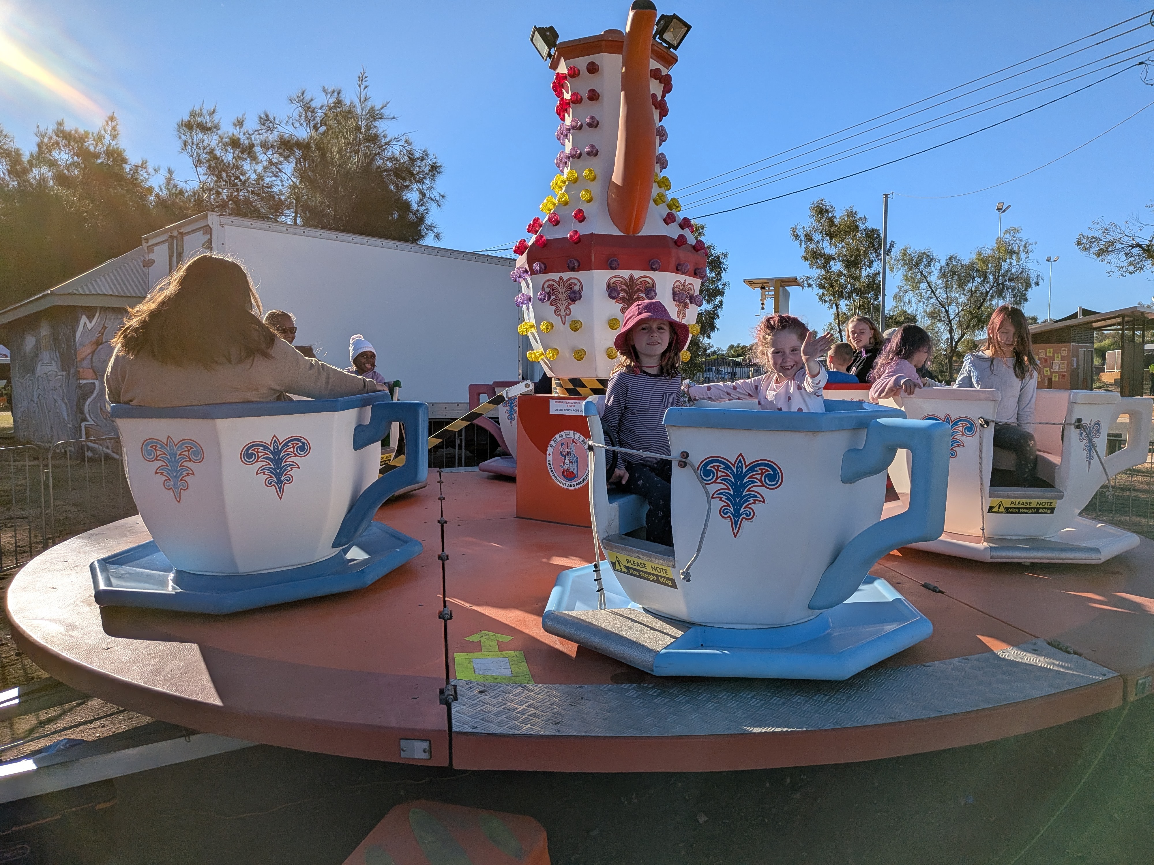 The girls on the teacup ride at the Newlandia Festival