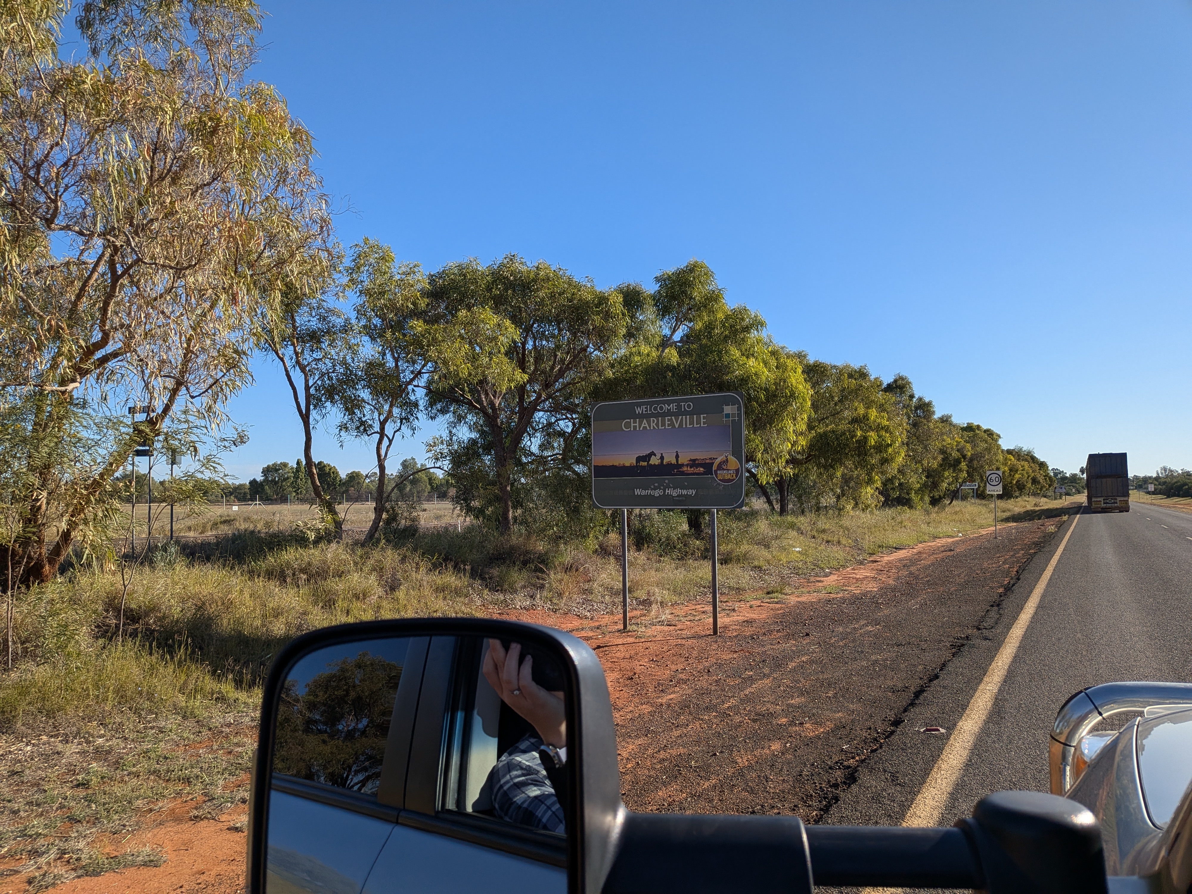 Welcome to Charleville sign — red dirt appearing