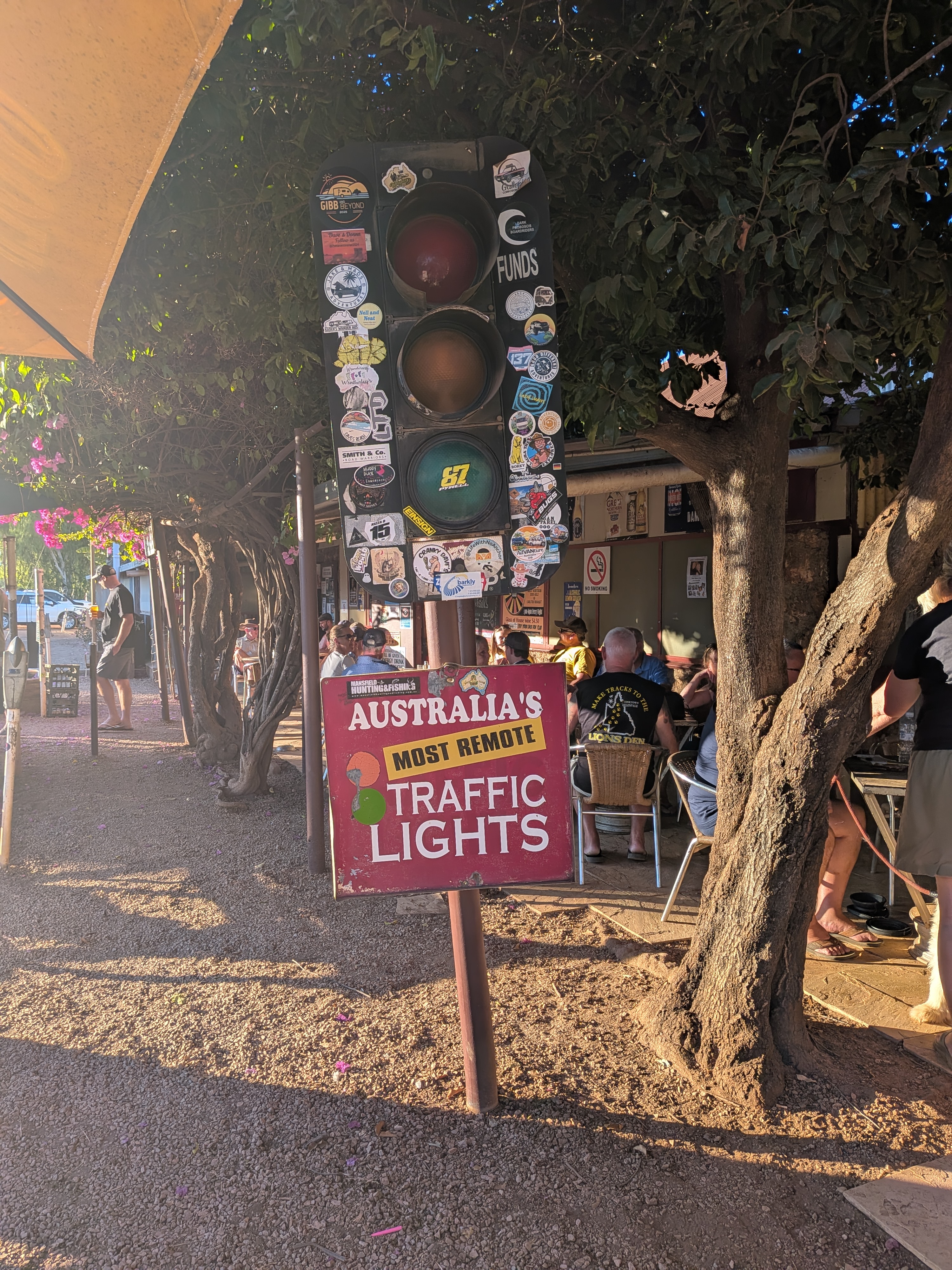 Australia's Most Remote Traffic Lights, plastered in travellers' stickers