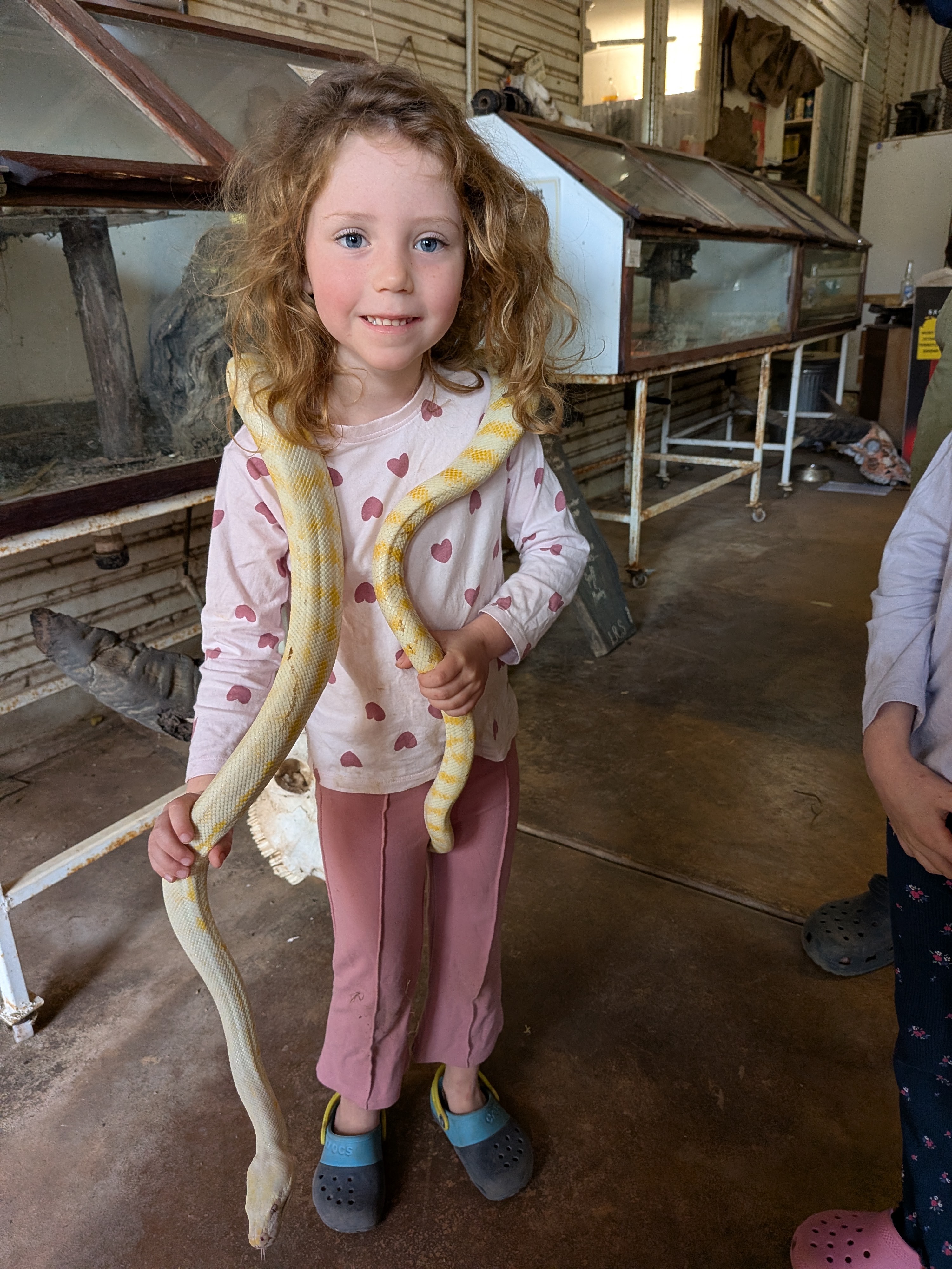 Leah with an albino python draped around her shoulders