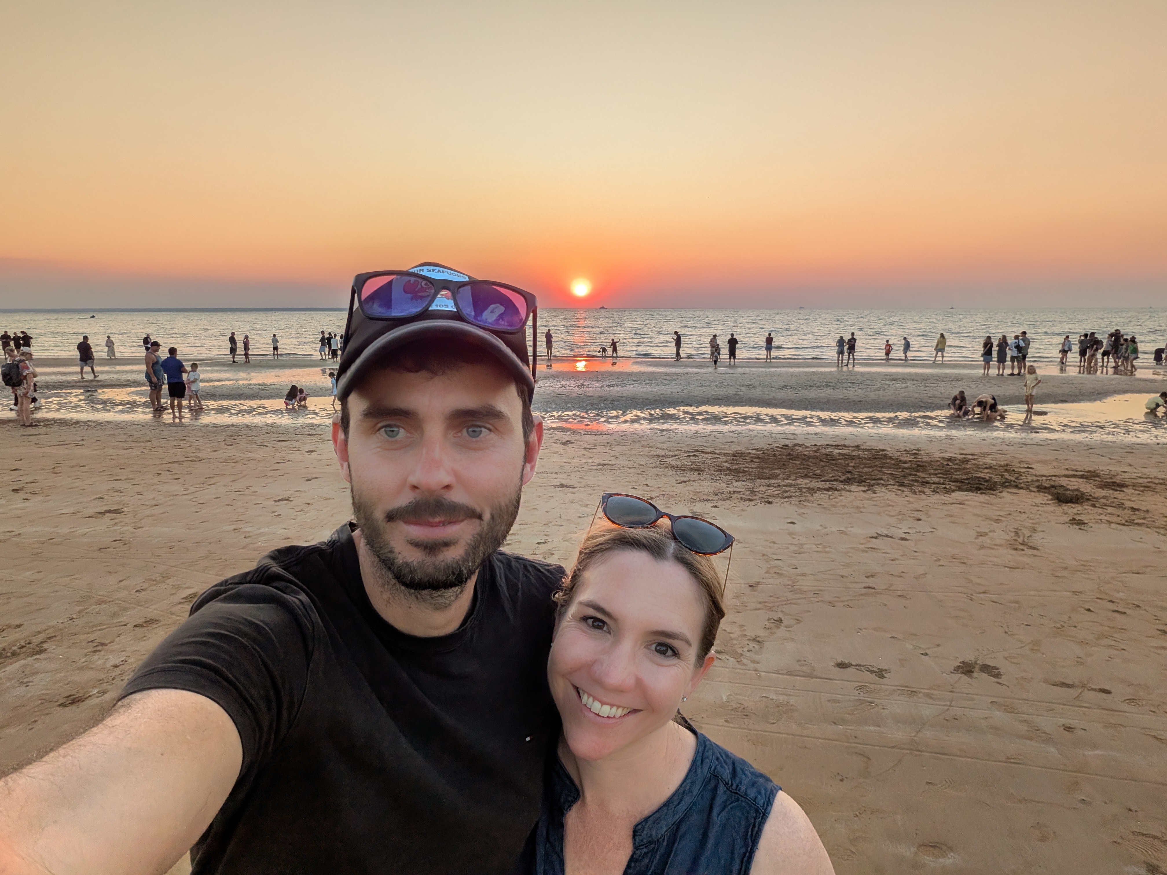 Dylan and Erin's selfie with the sun sitting right on the horizon at Mindil Beach