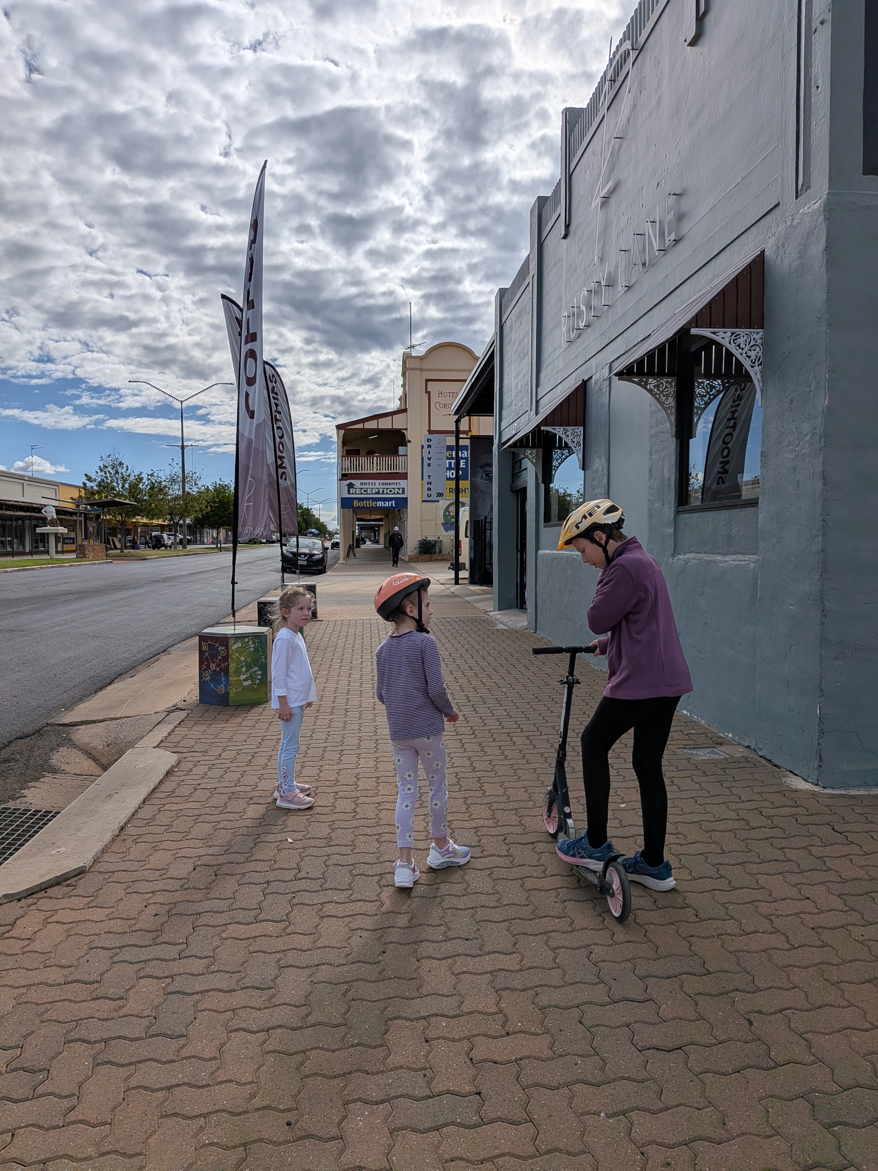 Erin and the girls scooting down Charleville main street