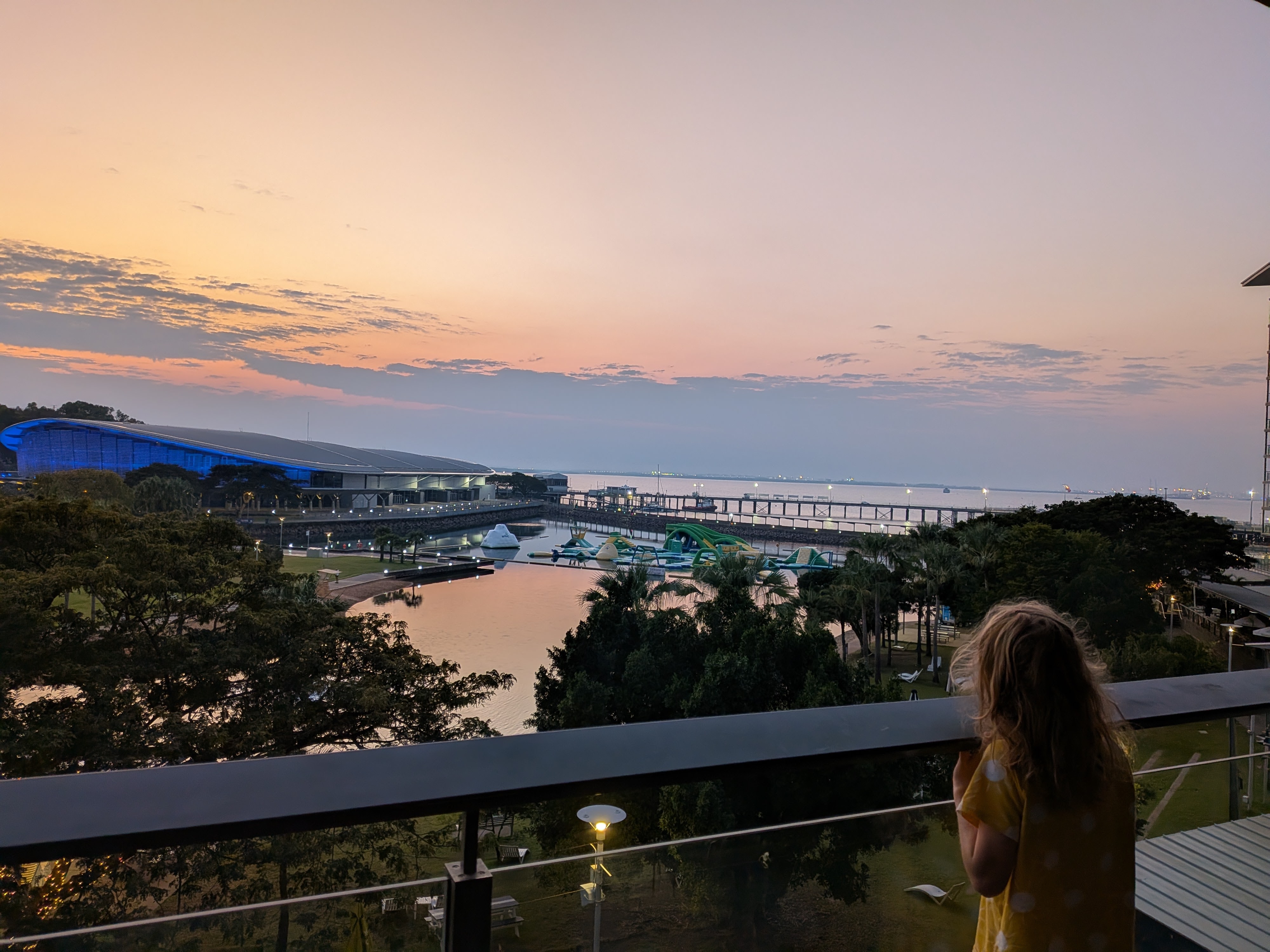 Hazel watching dawn break over the Wave Lagoon from the apartment balcony
