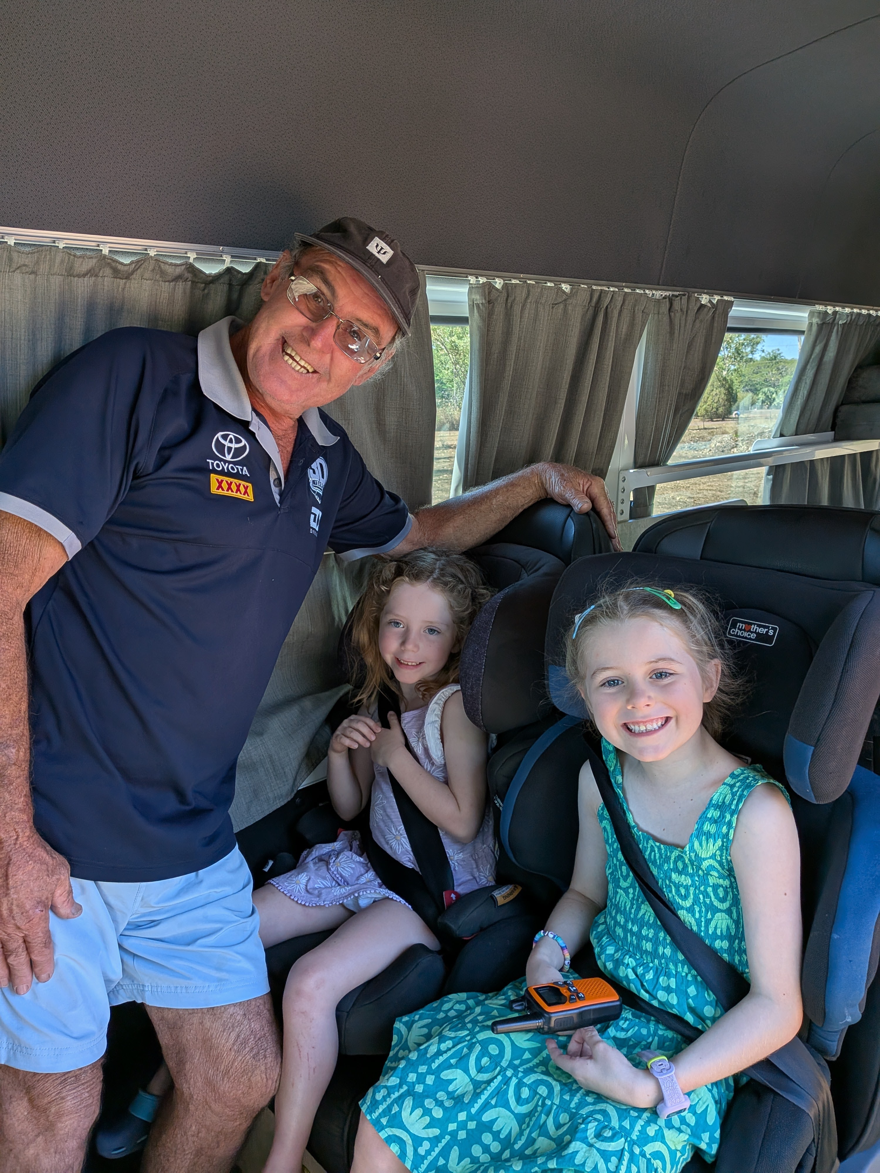 Hazel and Leah buckled into Lizzie&rsquo;s car seats for the first leg, walkie-talkie at the ready