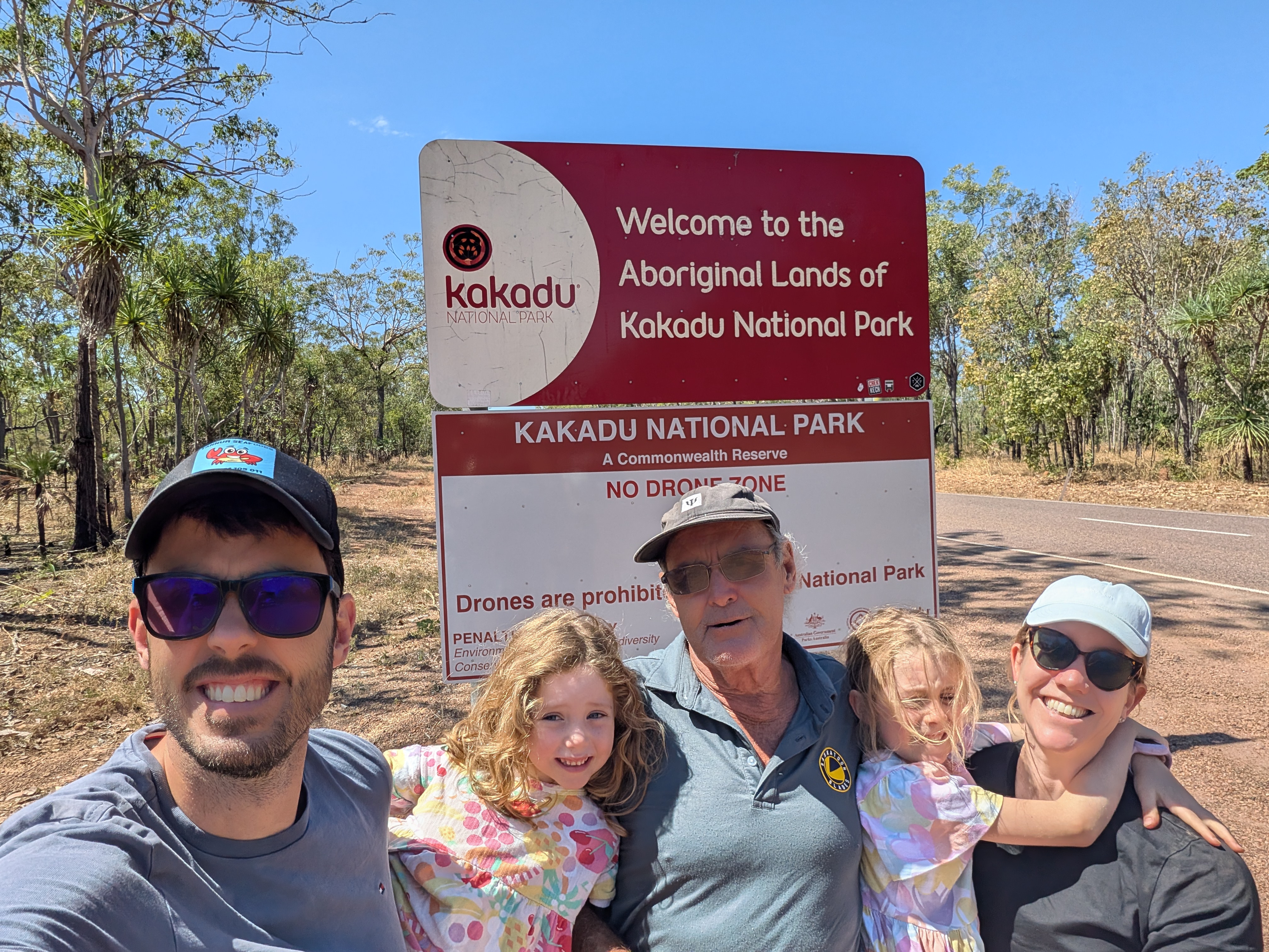 Family selfie at the Kakadu National Park welcome sign on the way in