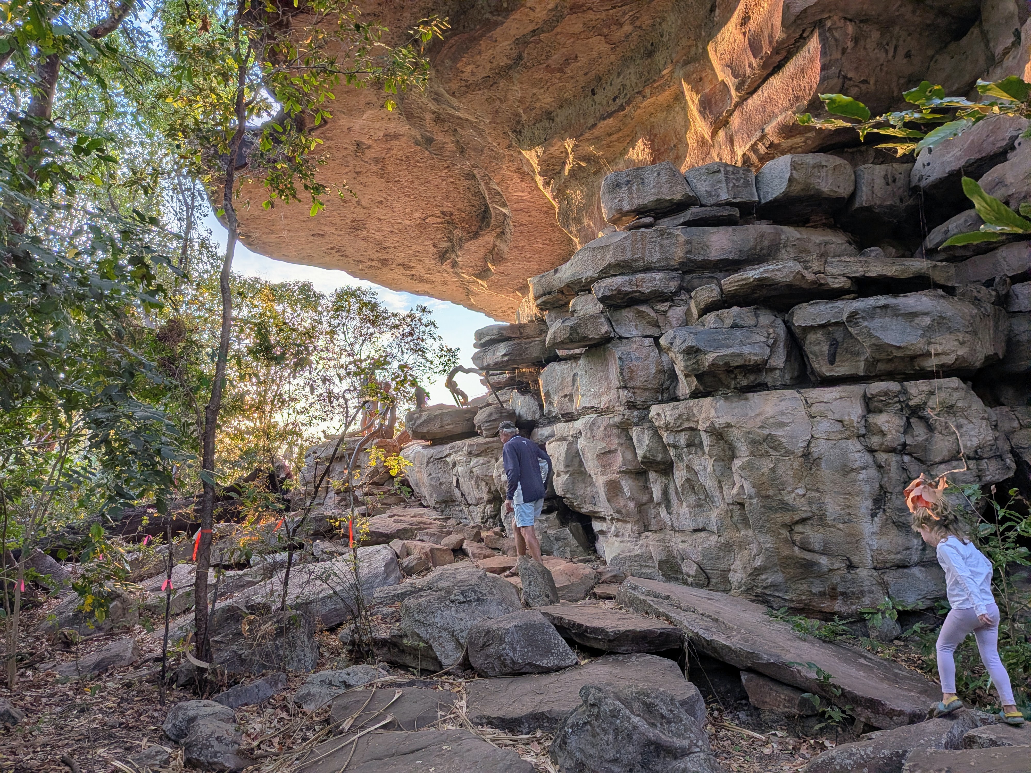 Climbing the rock shelves toward the Ubirr lookout in the last of the afternoon light