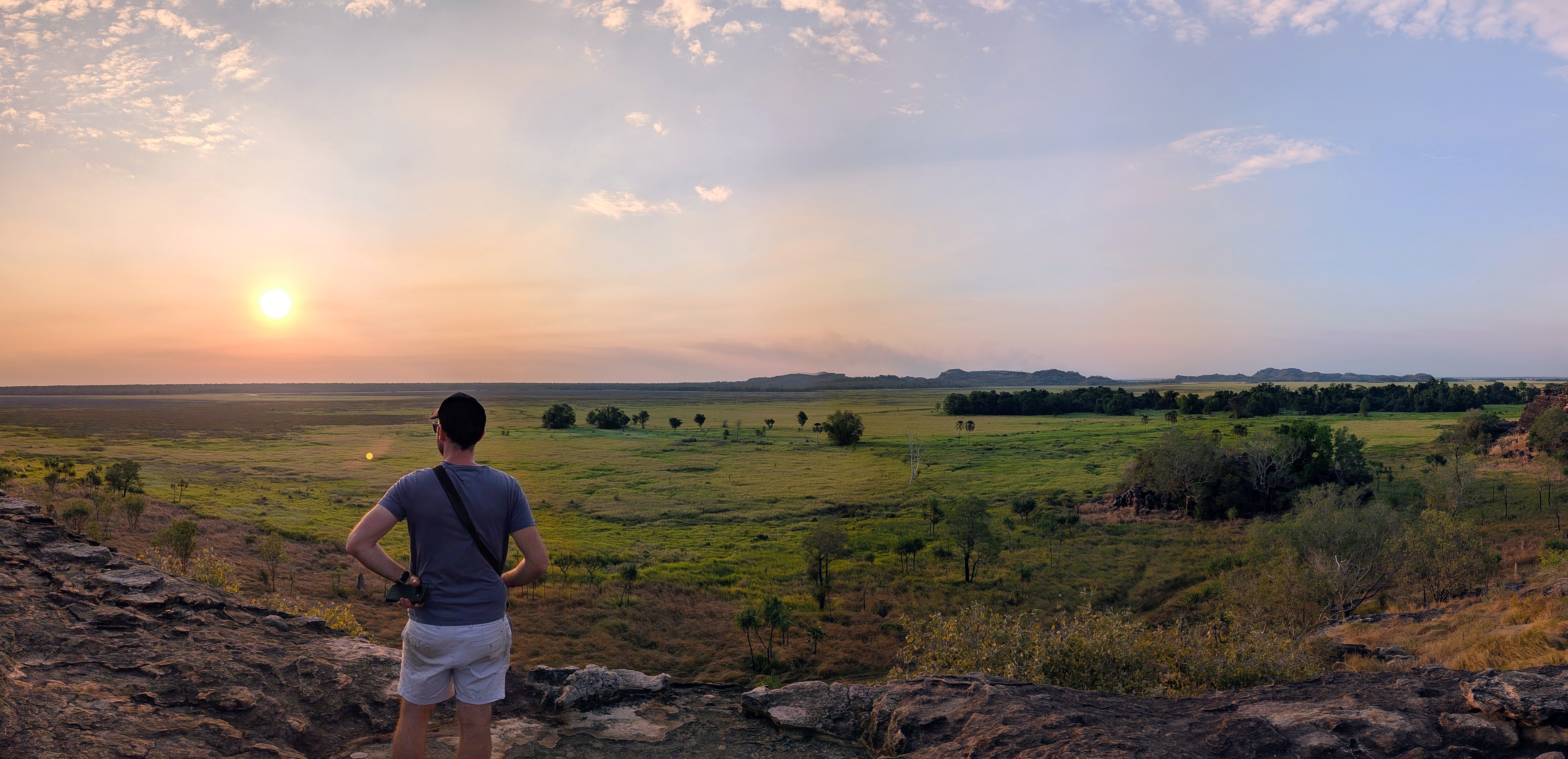 Dylan taking in the endless Nadab floodplain from the top of Ubirr as the sun drops