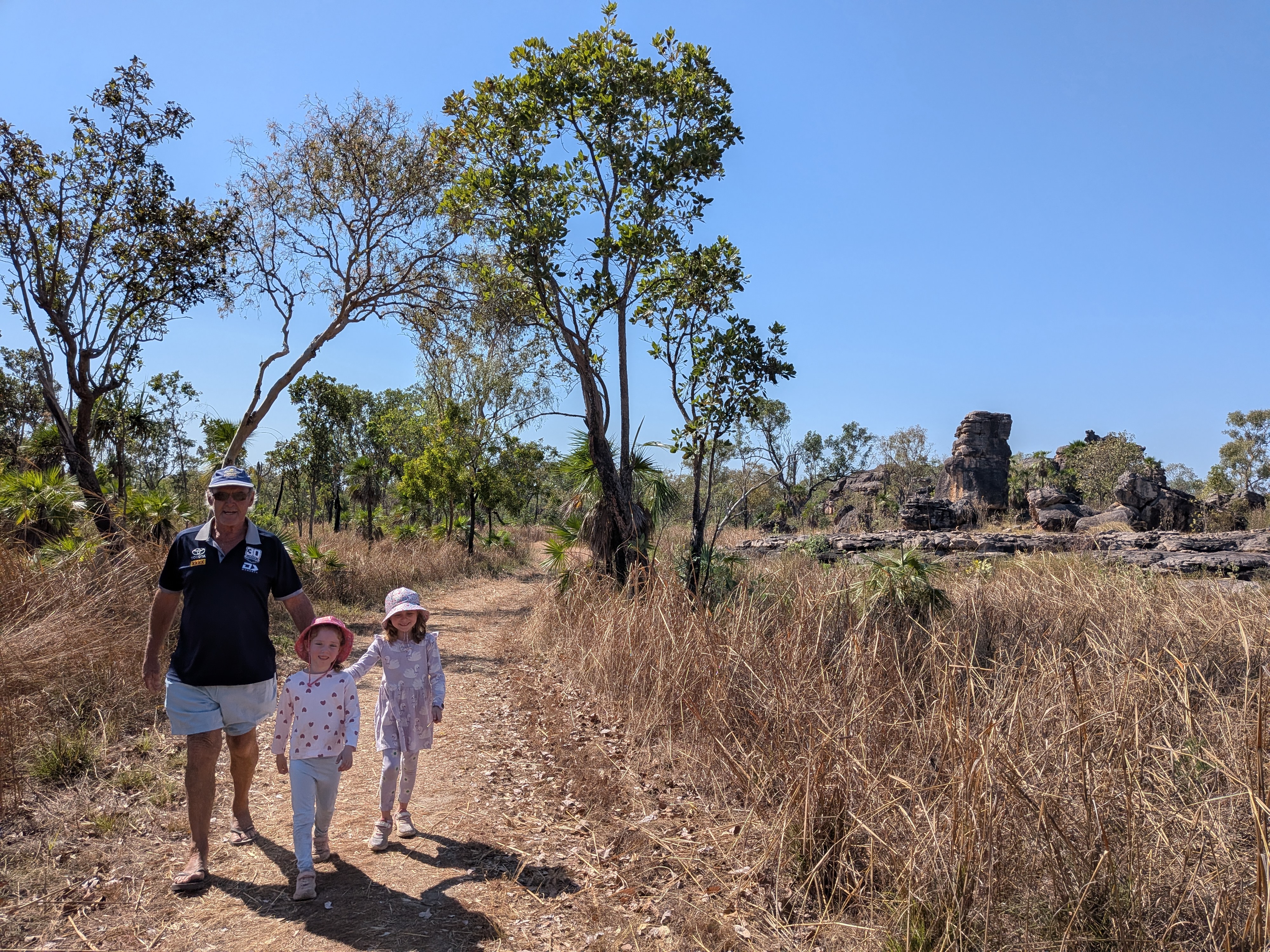 Pa and the girls on the dusty walk out to Cahills Crossing