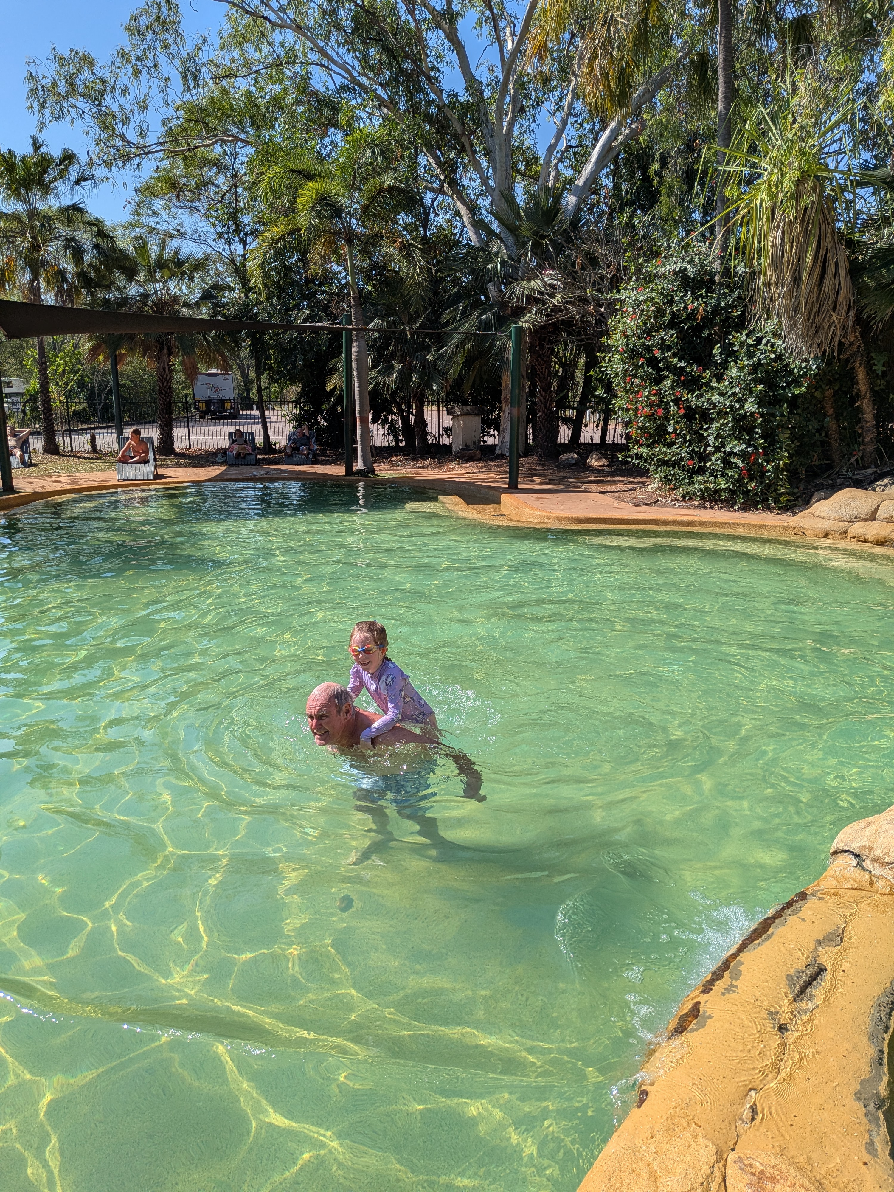 Pa and Leah mid-piggyback in the Cooinda Lodge pool
