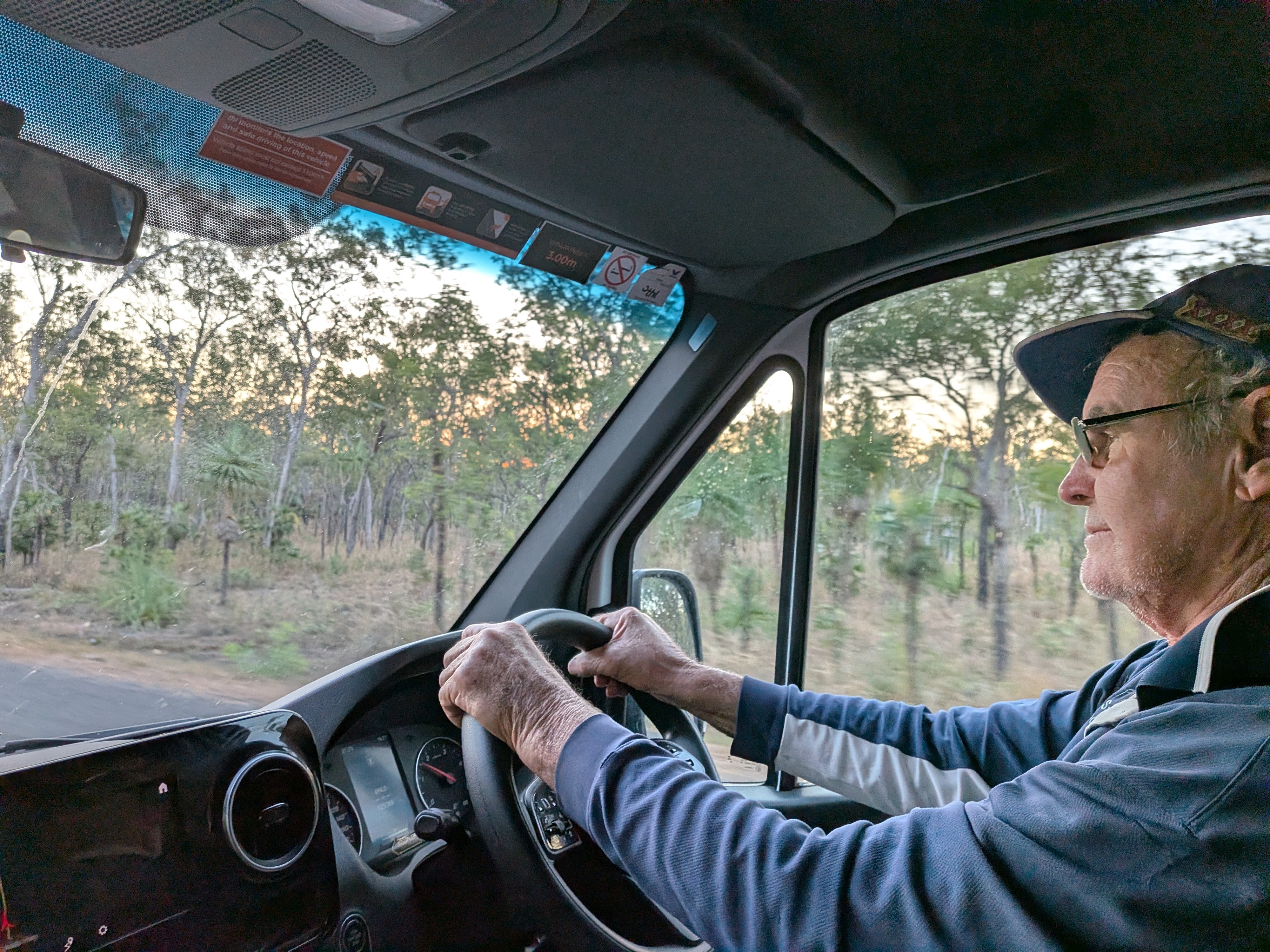 Pa at the wheel of Lizzie at dusk, personalised playlists no doubt playing