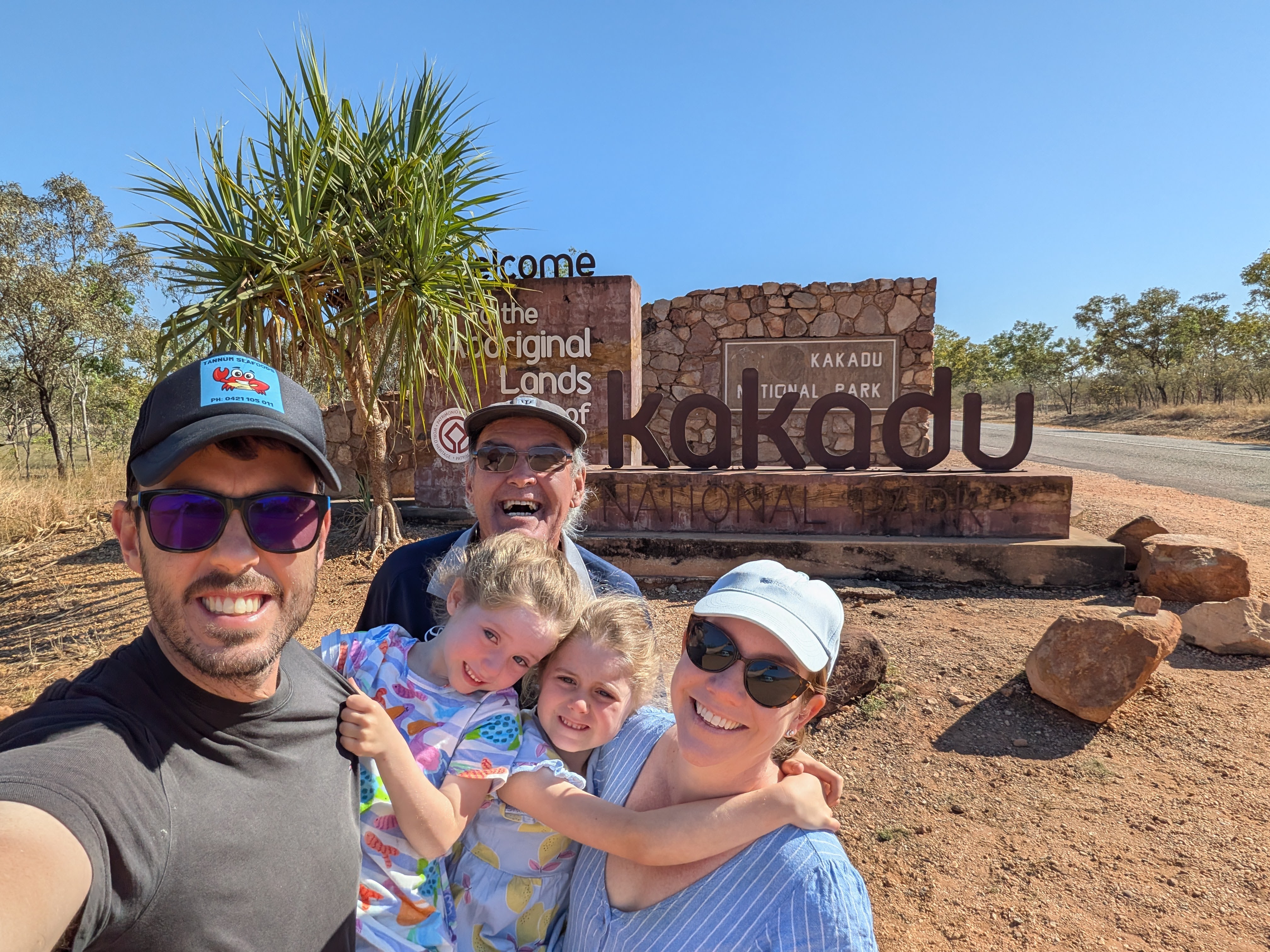 One last family photo at the Kakadu sign on the way out &mdash; thanks for having us