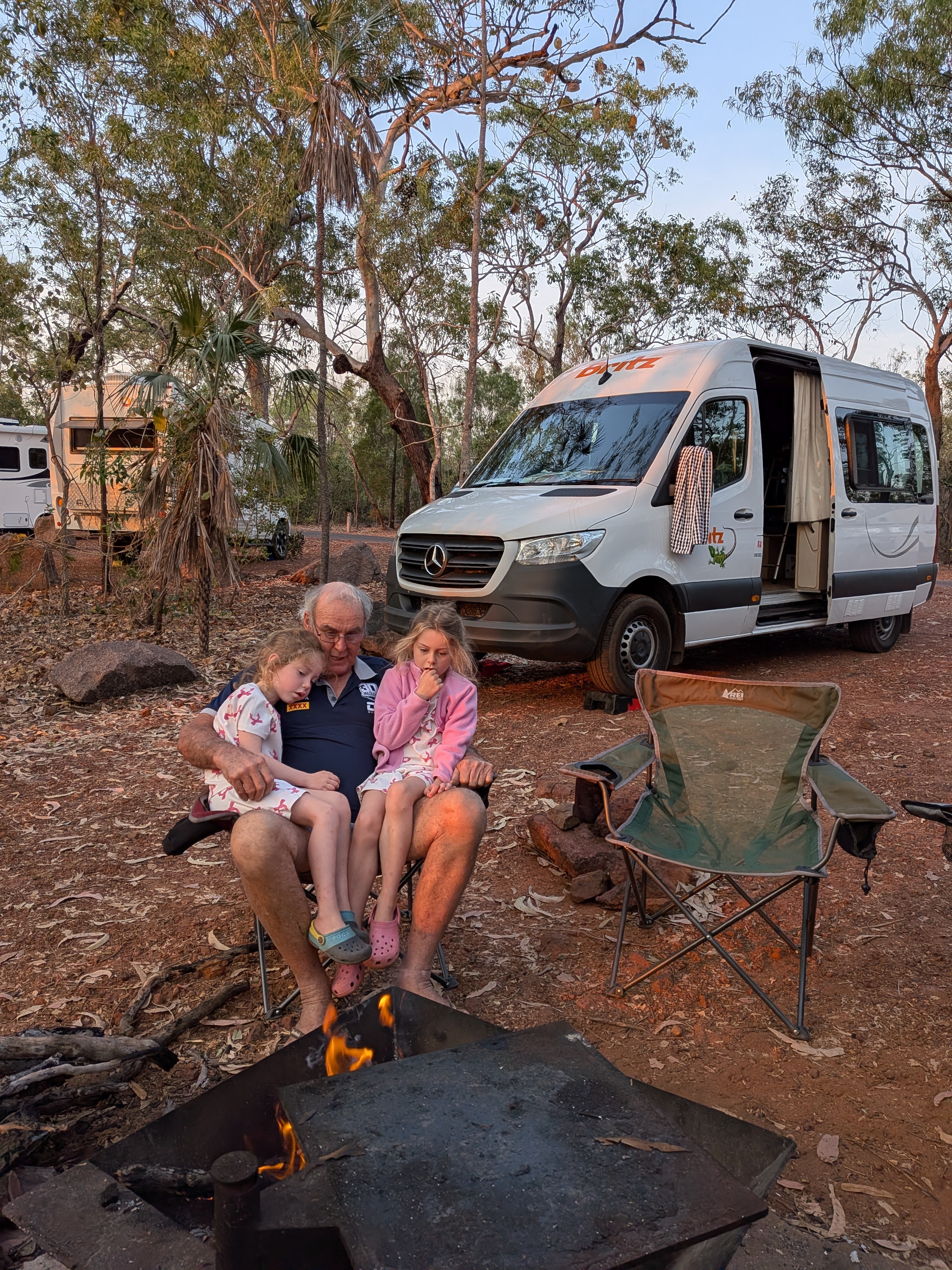 Pa with a full lap of girls at the breakfast campfire