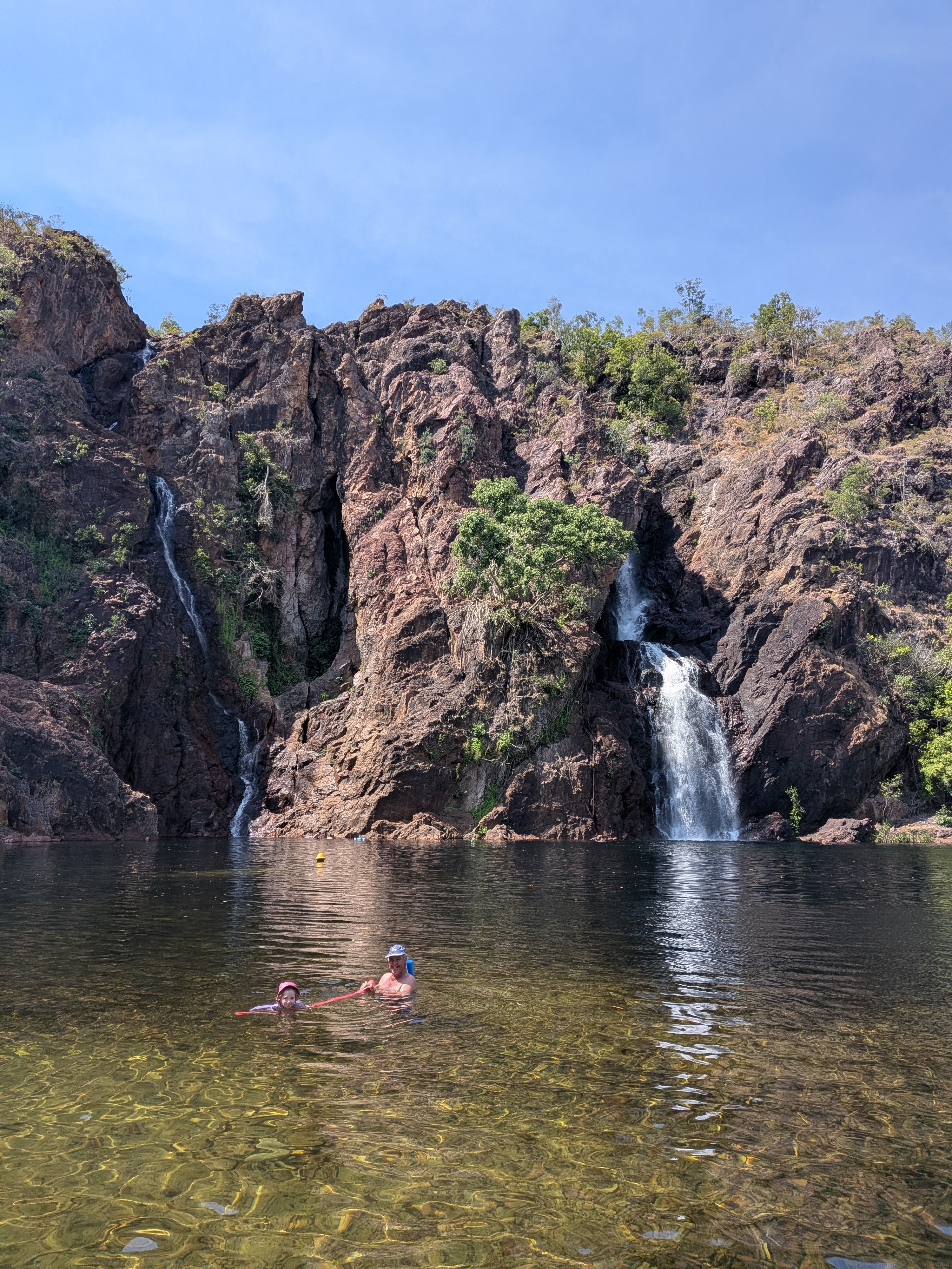 Wangi Falls for the explorers &mdash; Pa and one of the girls in the plunge pool