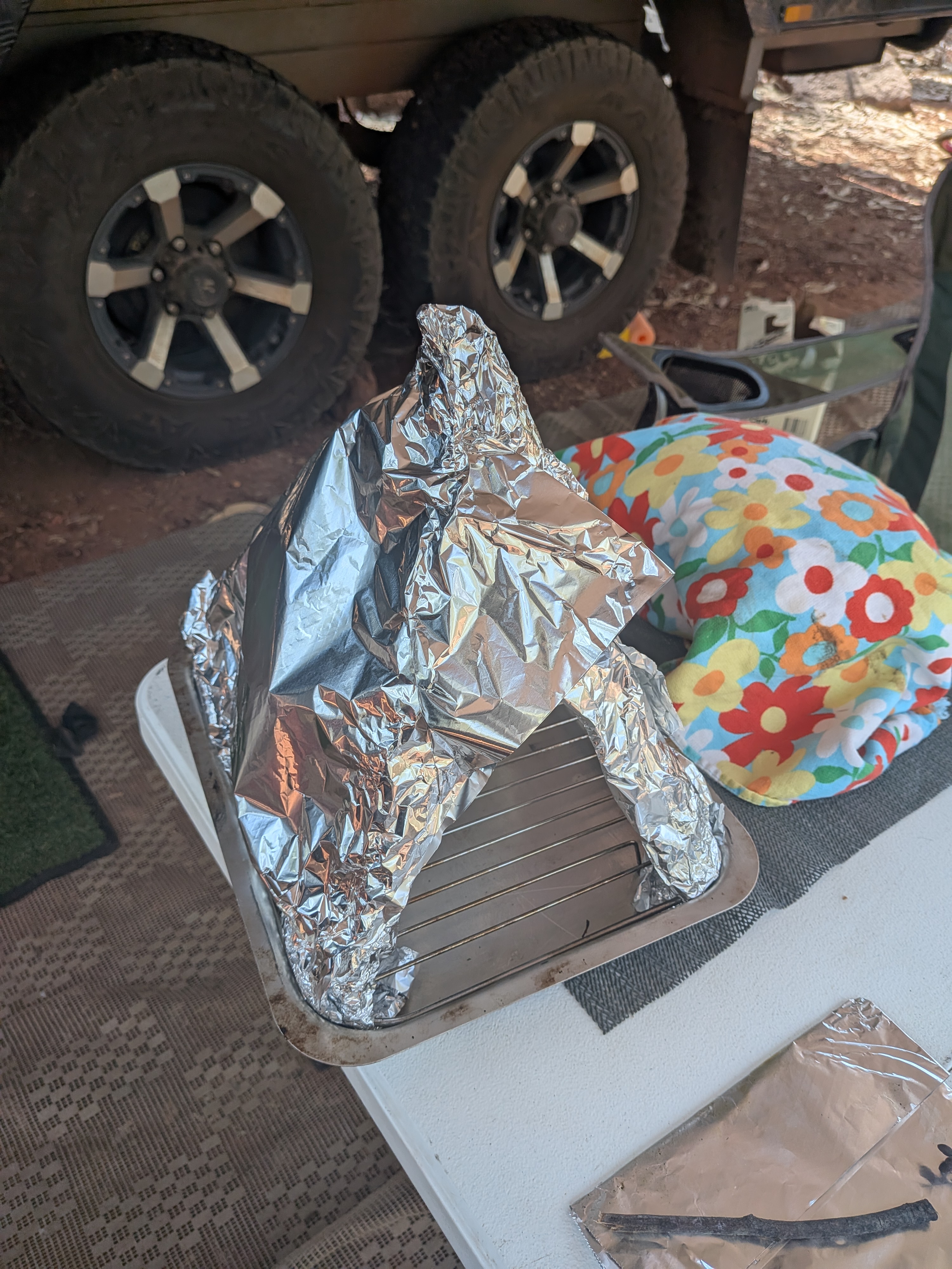 The DIY camp oven &mdash; alfoil, sticks, and a refusal to be beaten