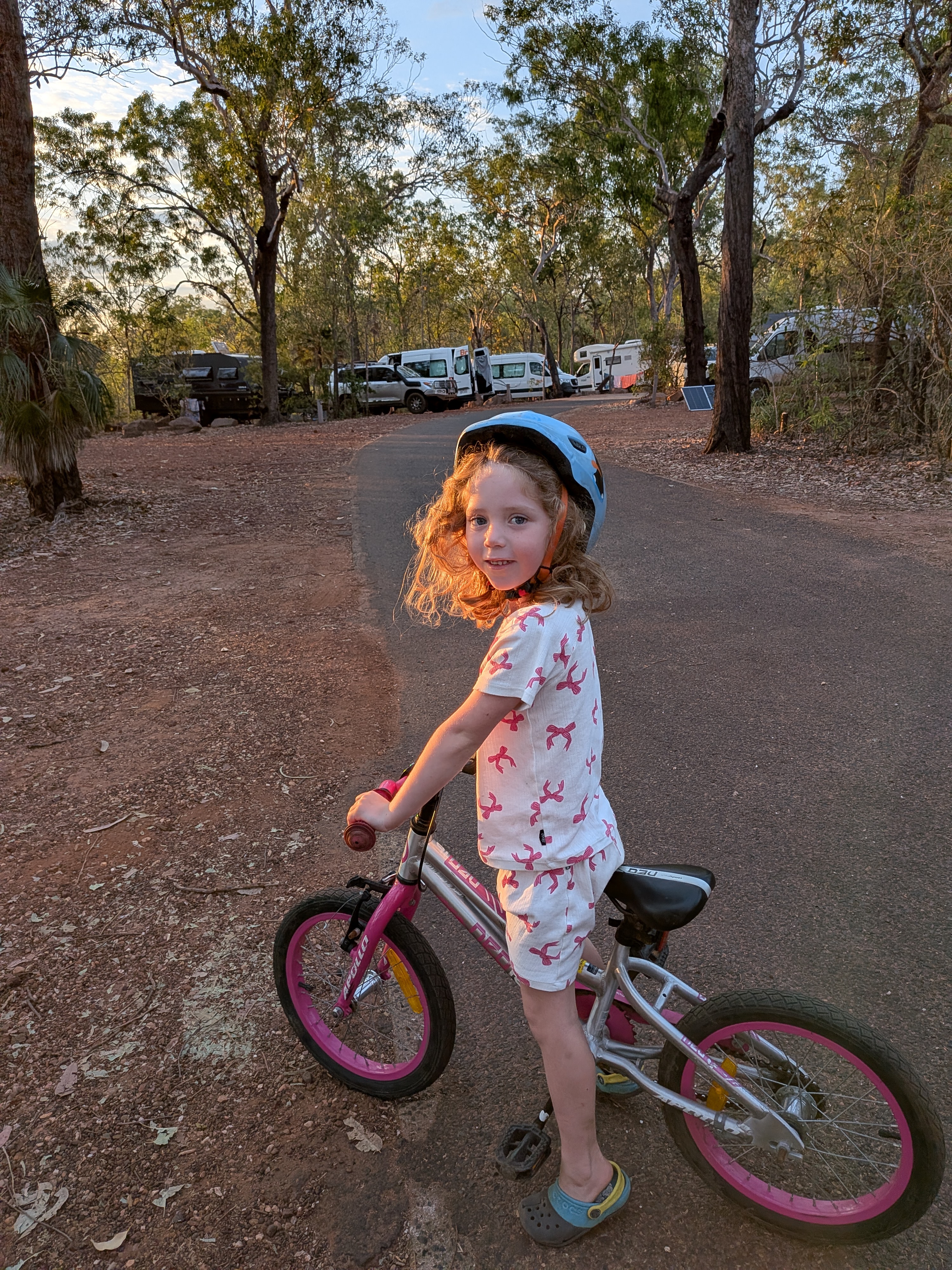 Leah doing laps of the campground in the golden morning light