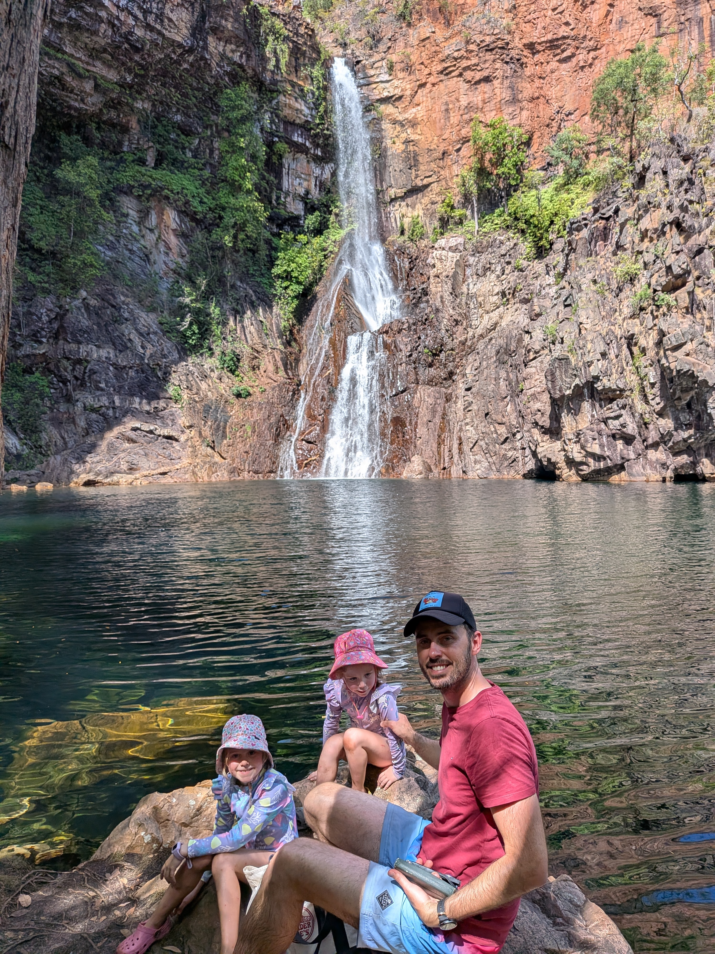 Dylan and the girls on the rocks at Sandy Creek Falls