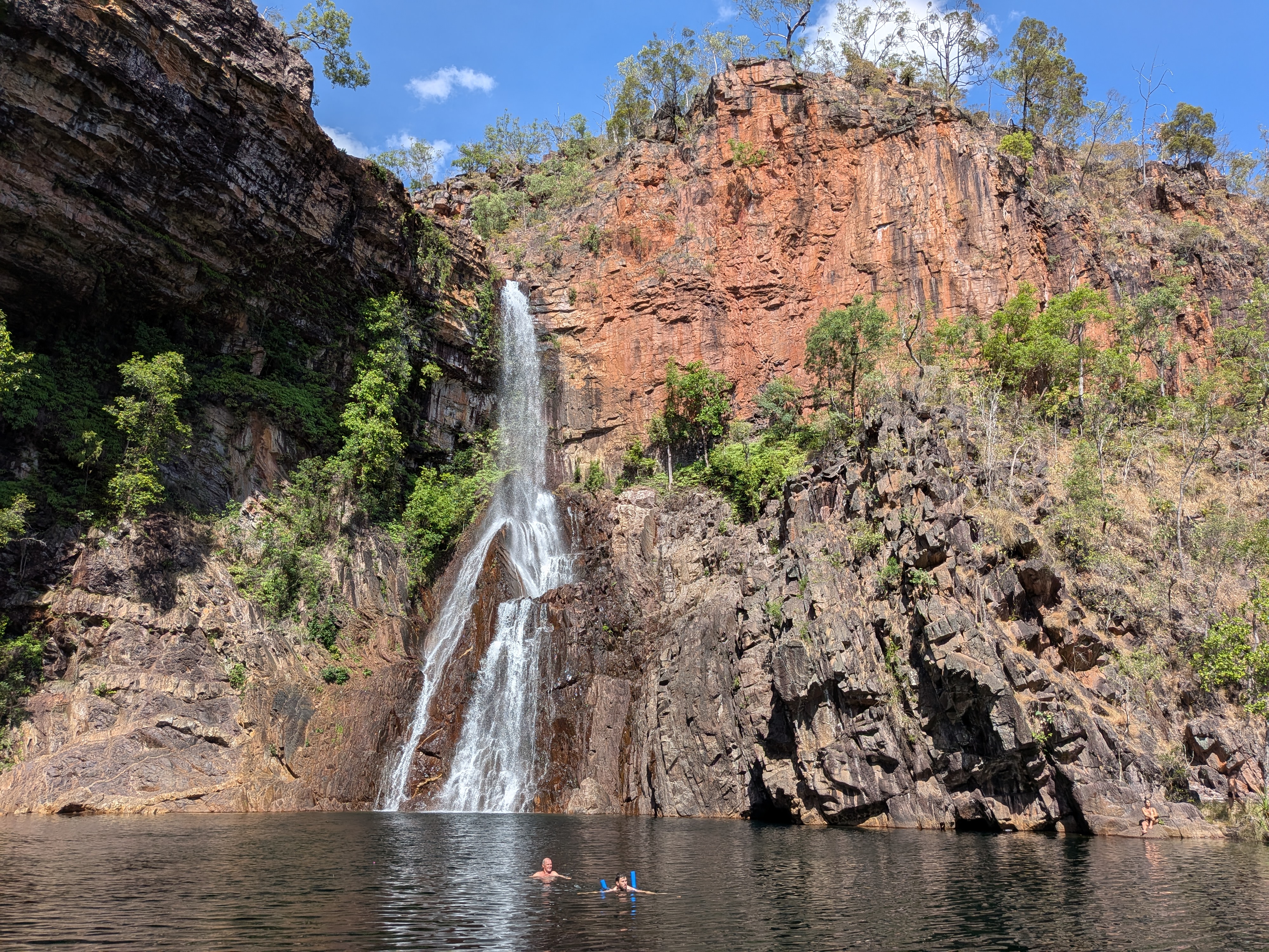 Pa and Dylan swimming out to touch the waterfall