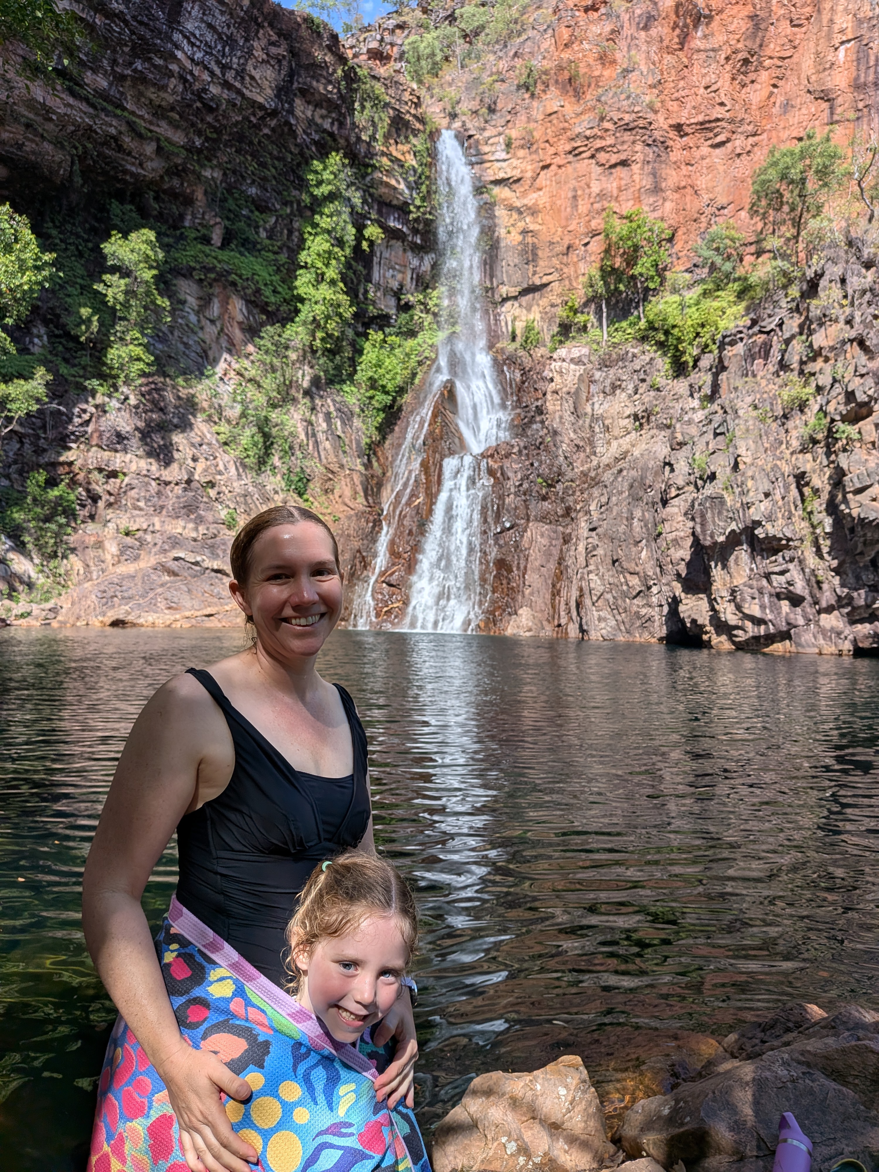 Erin and Leah warming up after a swim in the falls