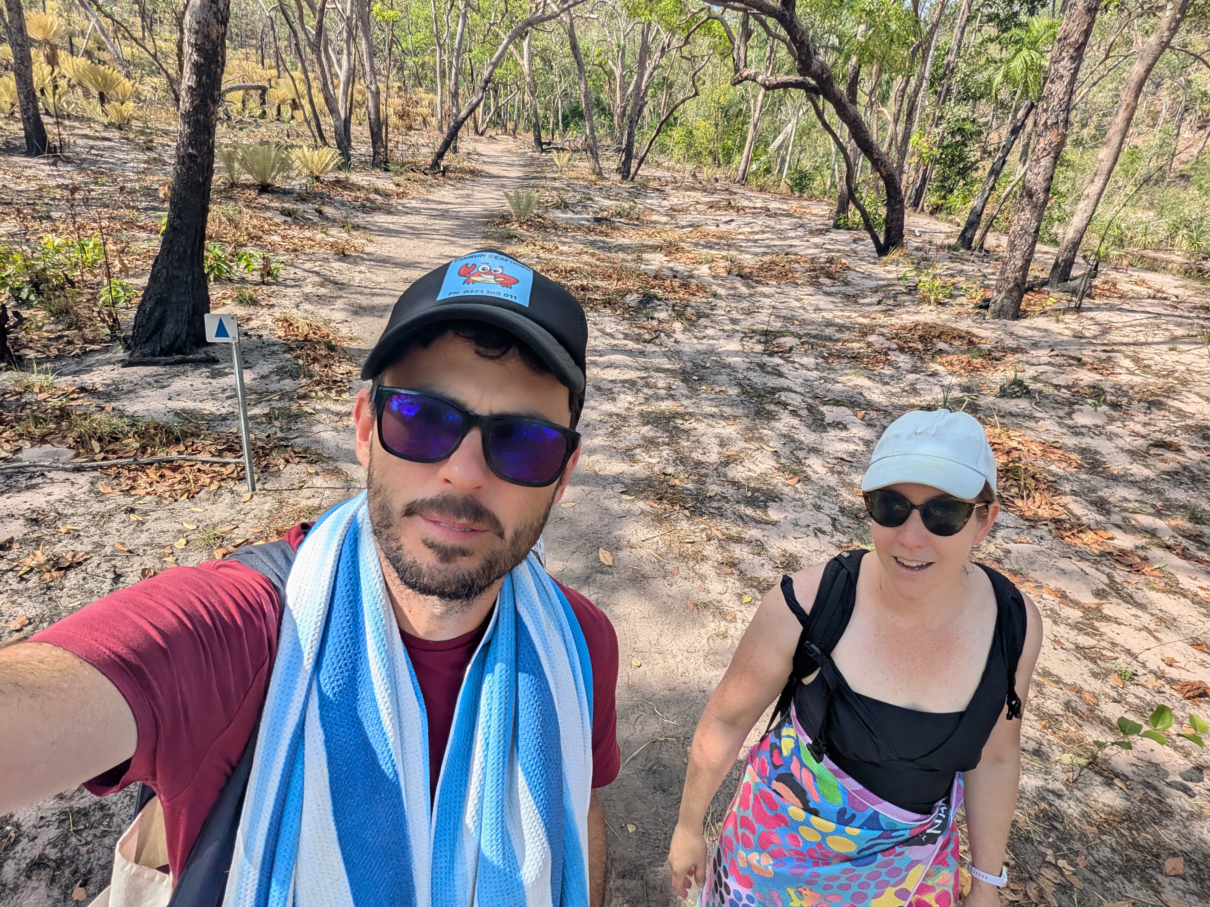 The two creek-crossing drivers on the sandy walk back out