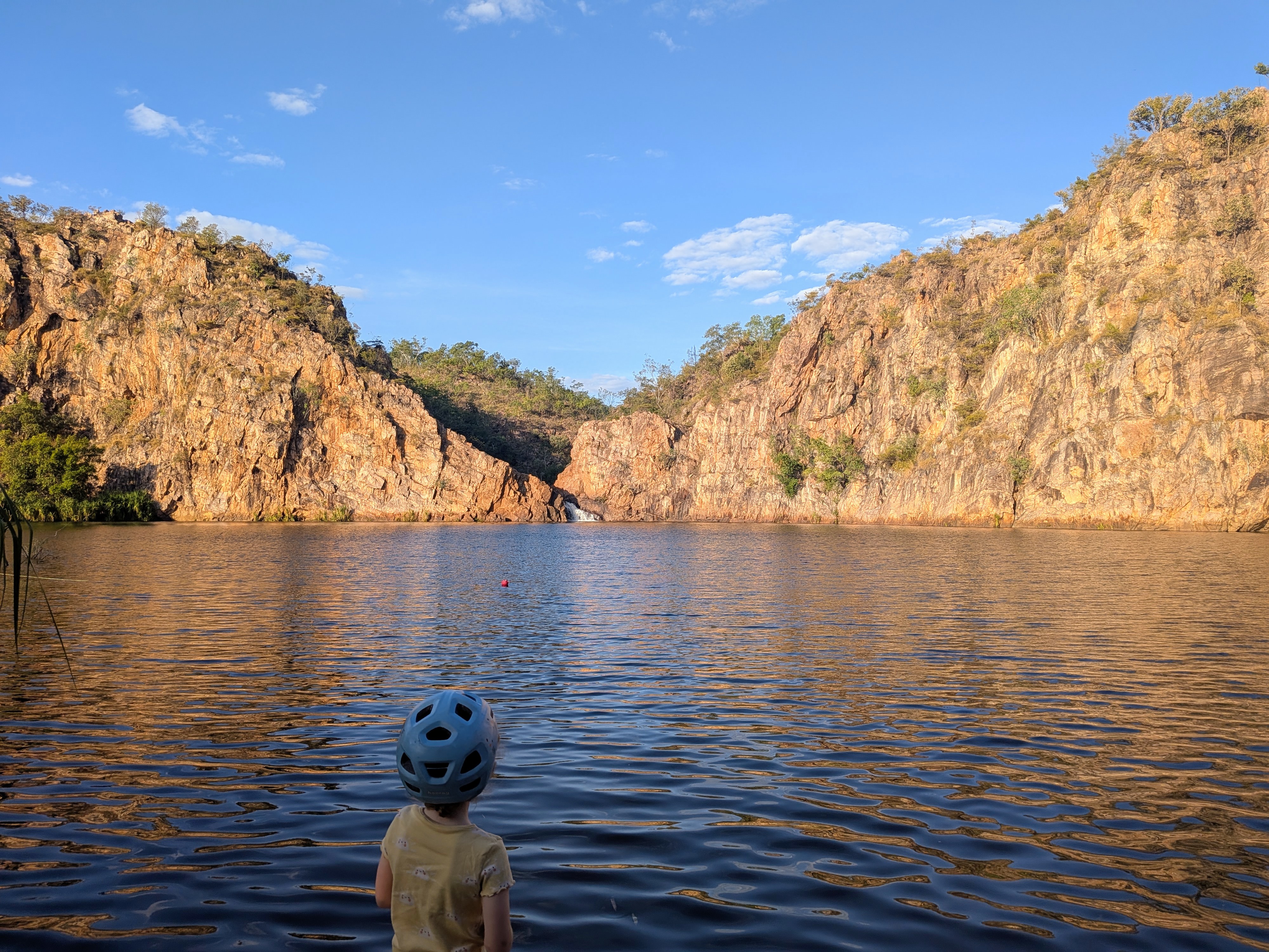 Straight off the bike for a golden-hour gaze across the Edith Falls pool