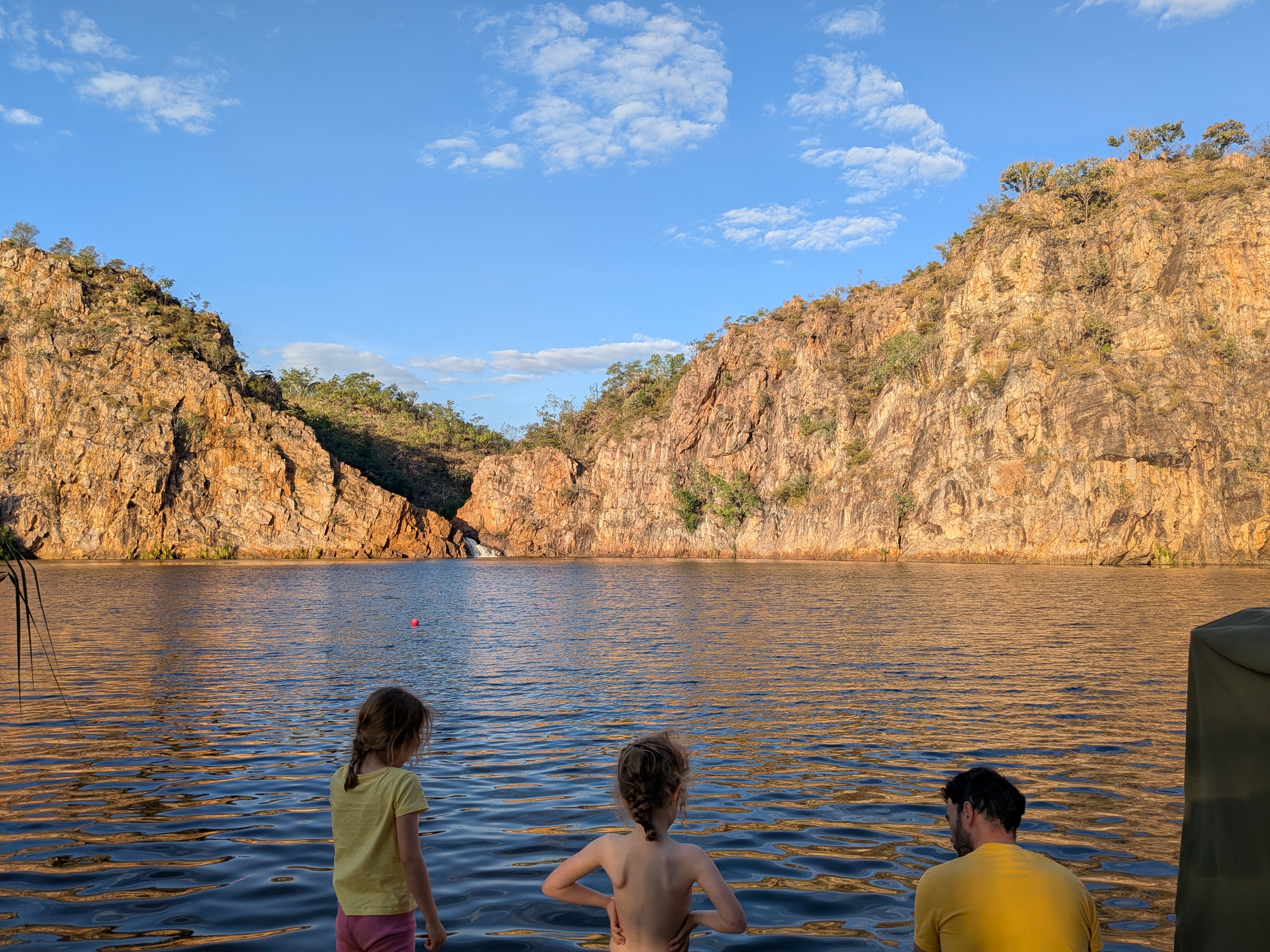 Dylan and the girls watching the falls across the glassy pool