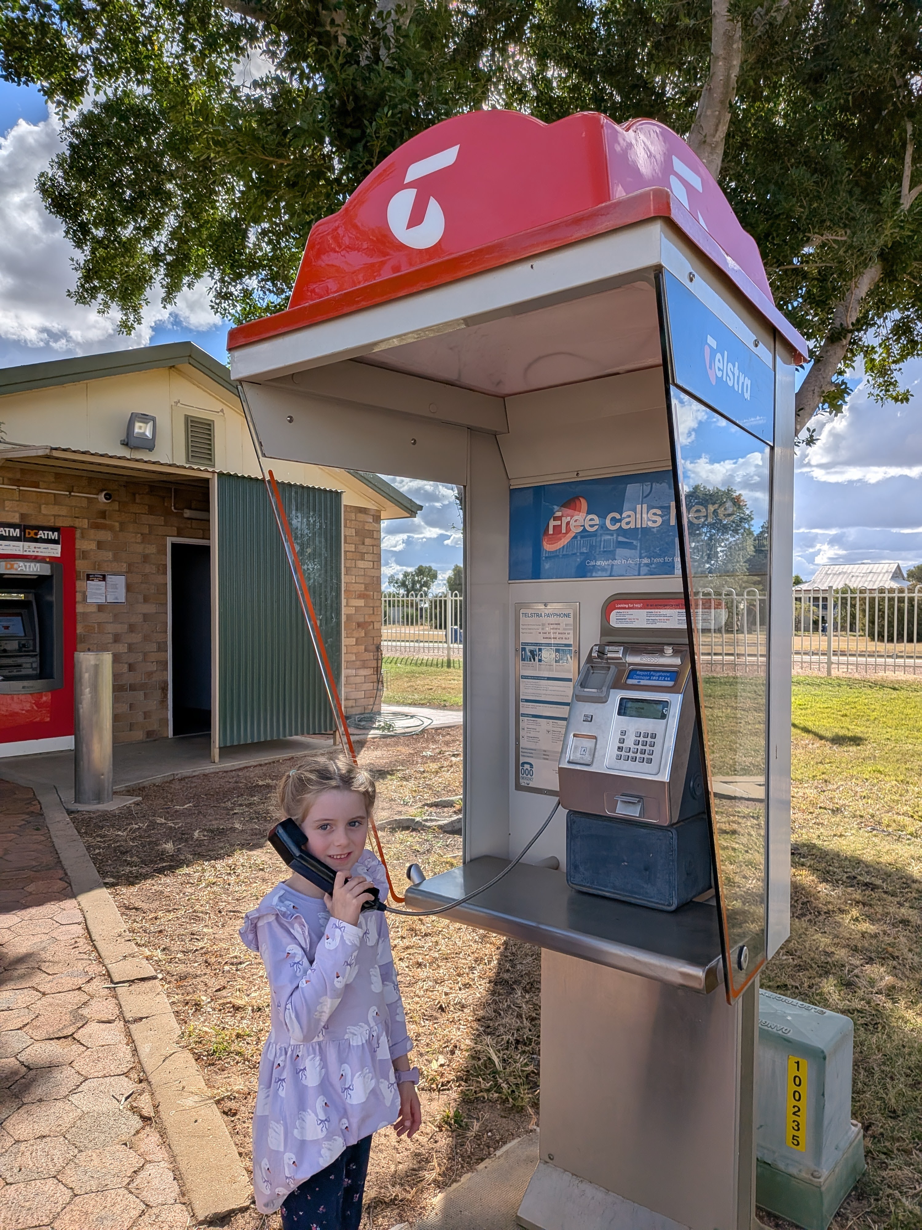 Leah on the Telstra payphone in Barcaldine
