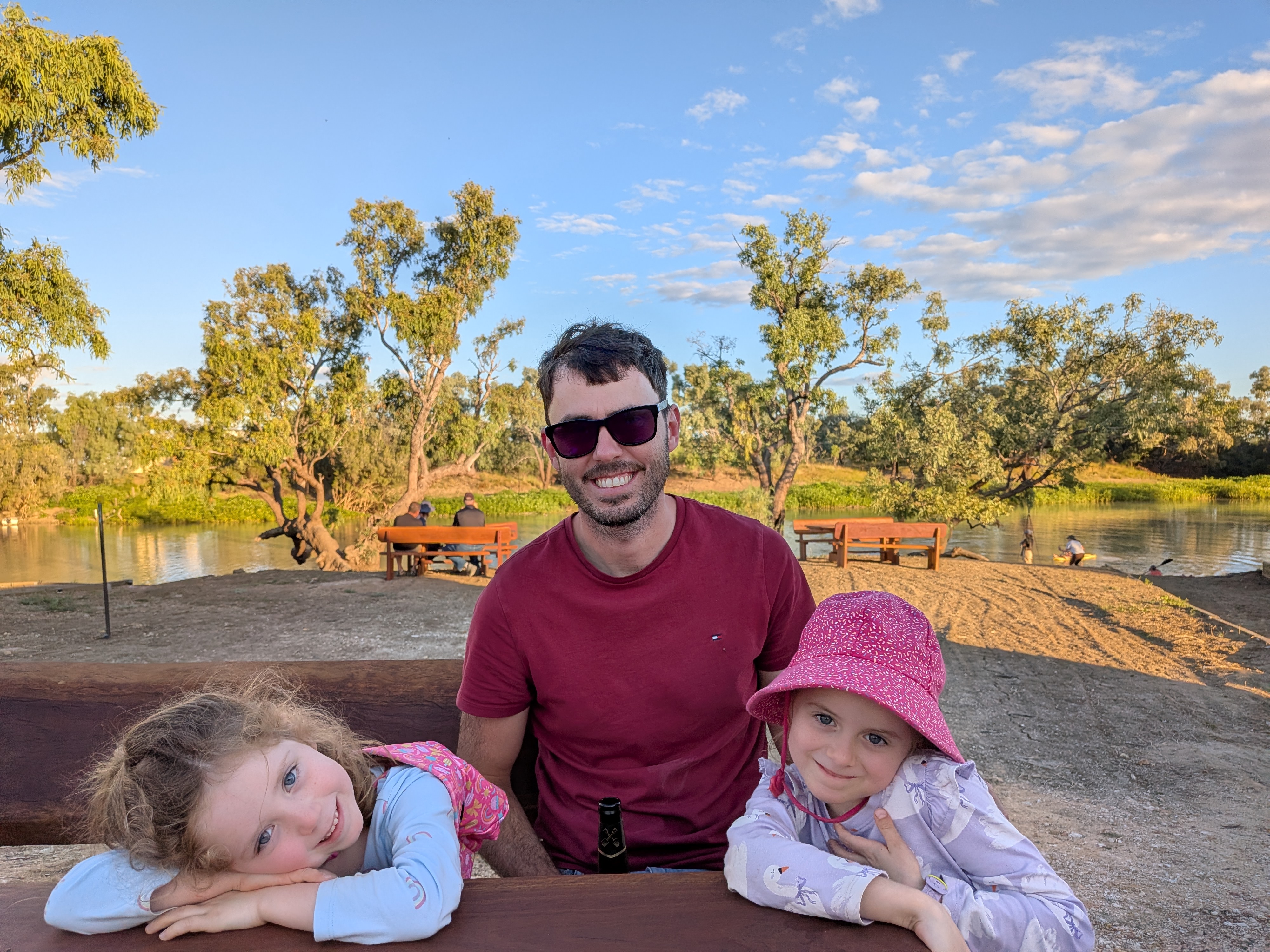 James and the girls at sunset by the Thomson River at Muddy Duck