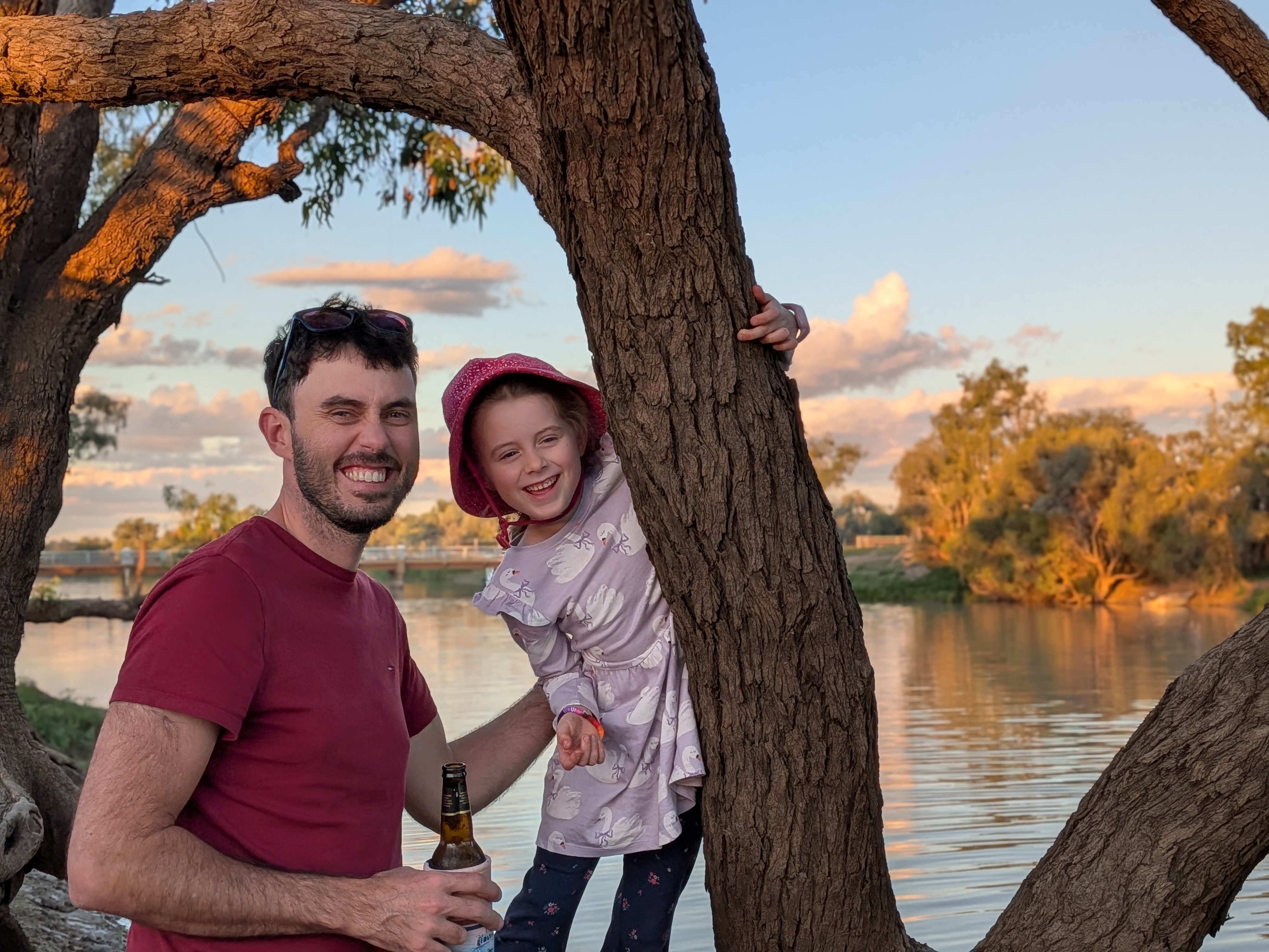 James and Leah by the river at sunset