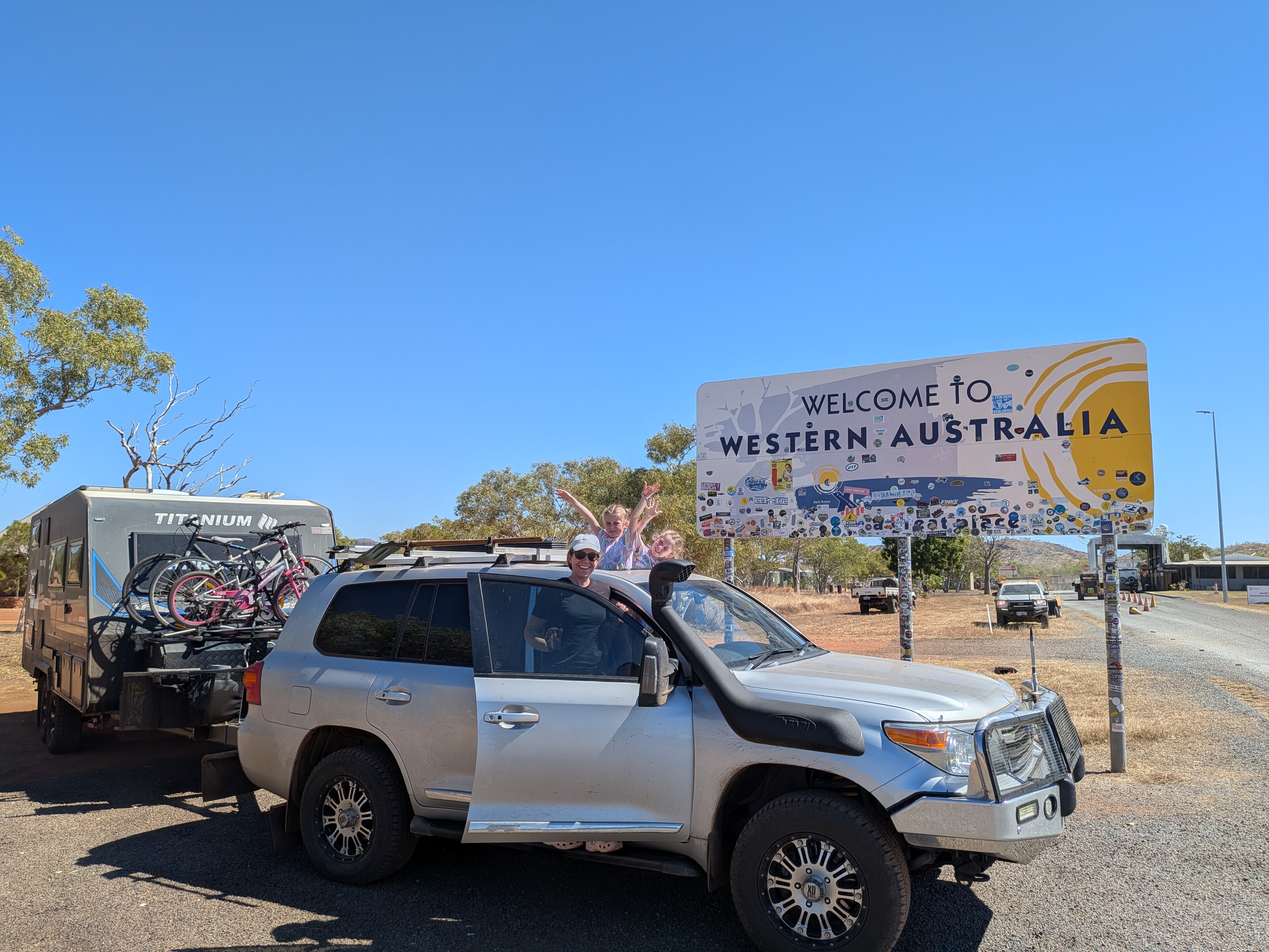 Arms out the windows at the WA border &mdash; goodbye NT!