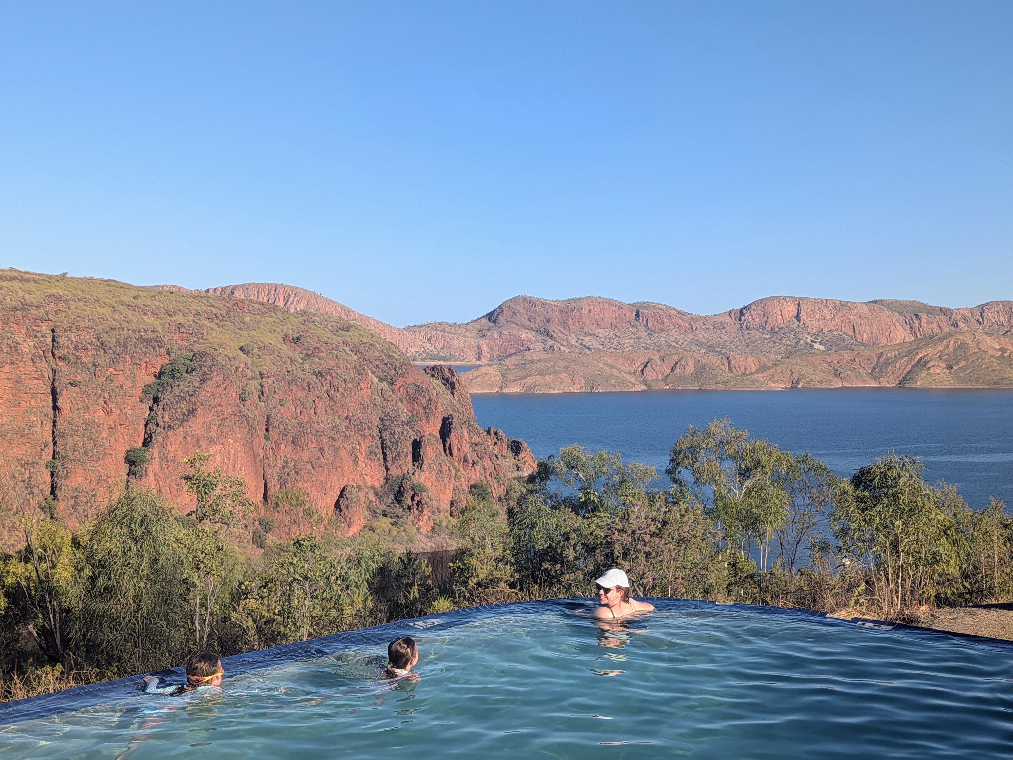 In the infinity pool with Lake Argyle stretching out behind