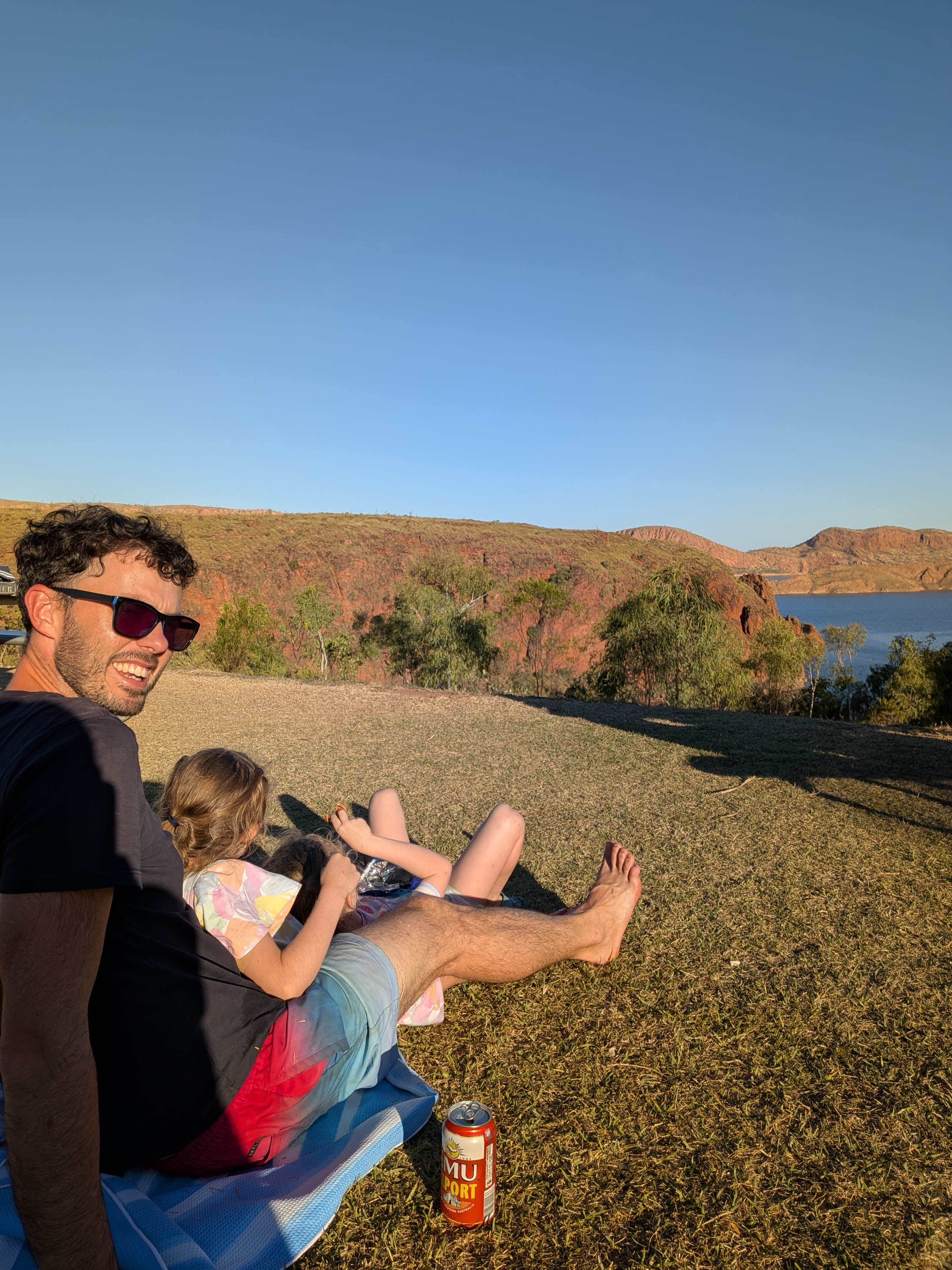 Golden hour on the grass above the pool