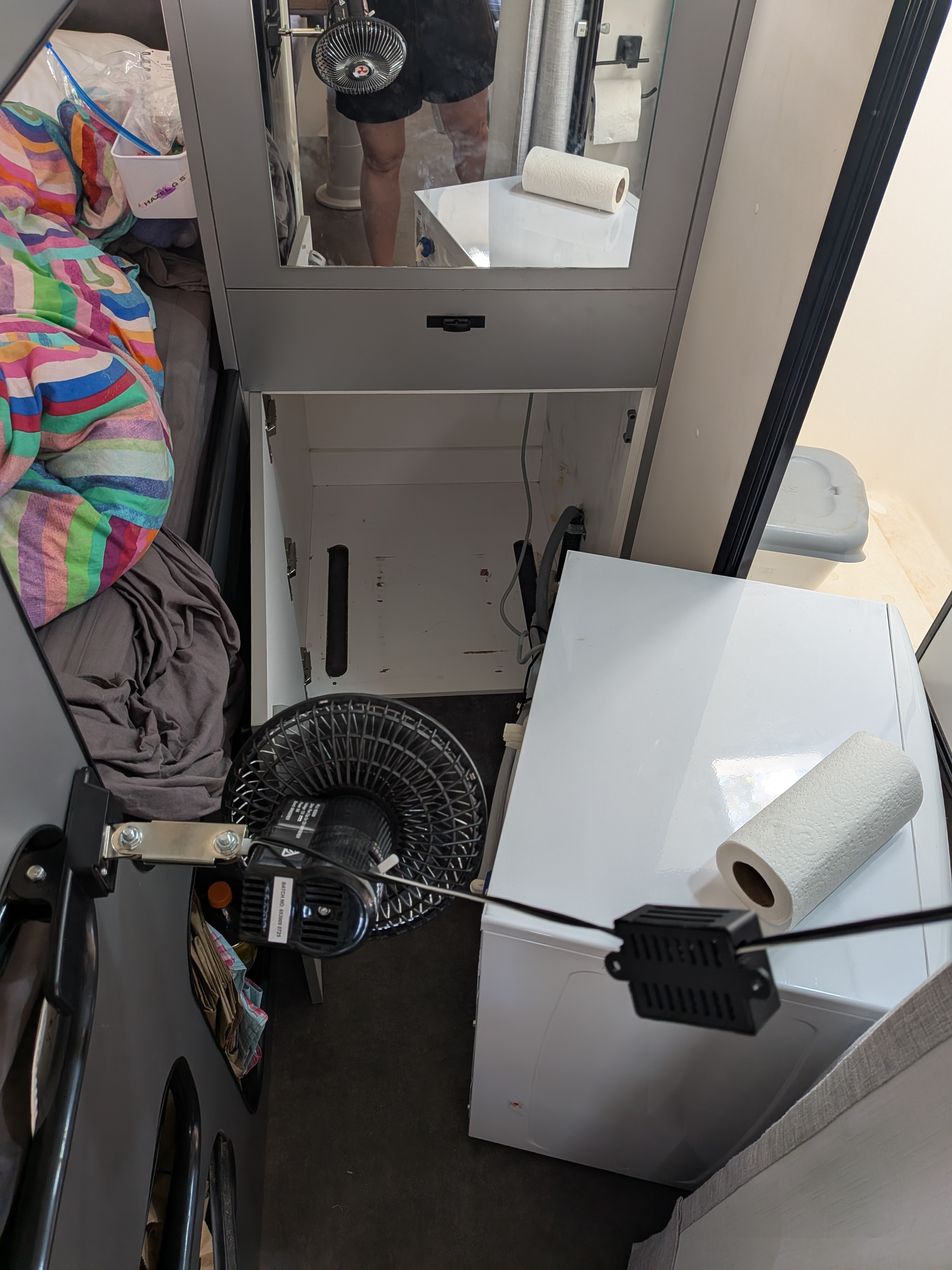 The flood clean-up &mdash; washing machine out, cupboards open and every fan we own drying the back of the van