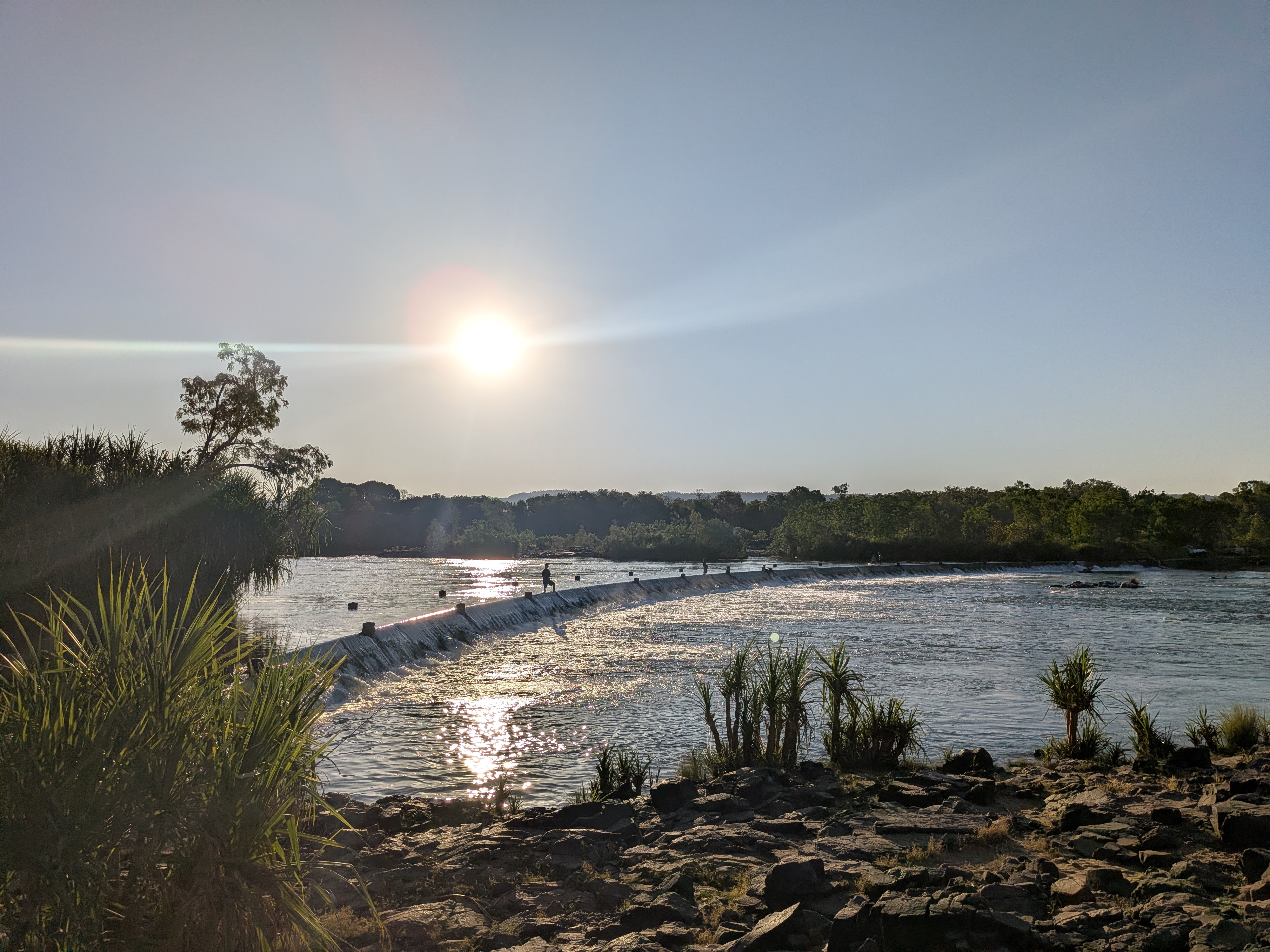 Late sun over Ivanhoe Crossing, fishermen out on the causeway