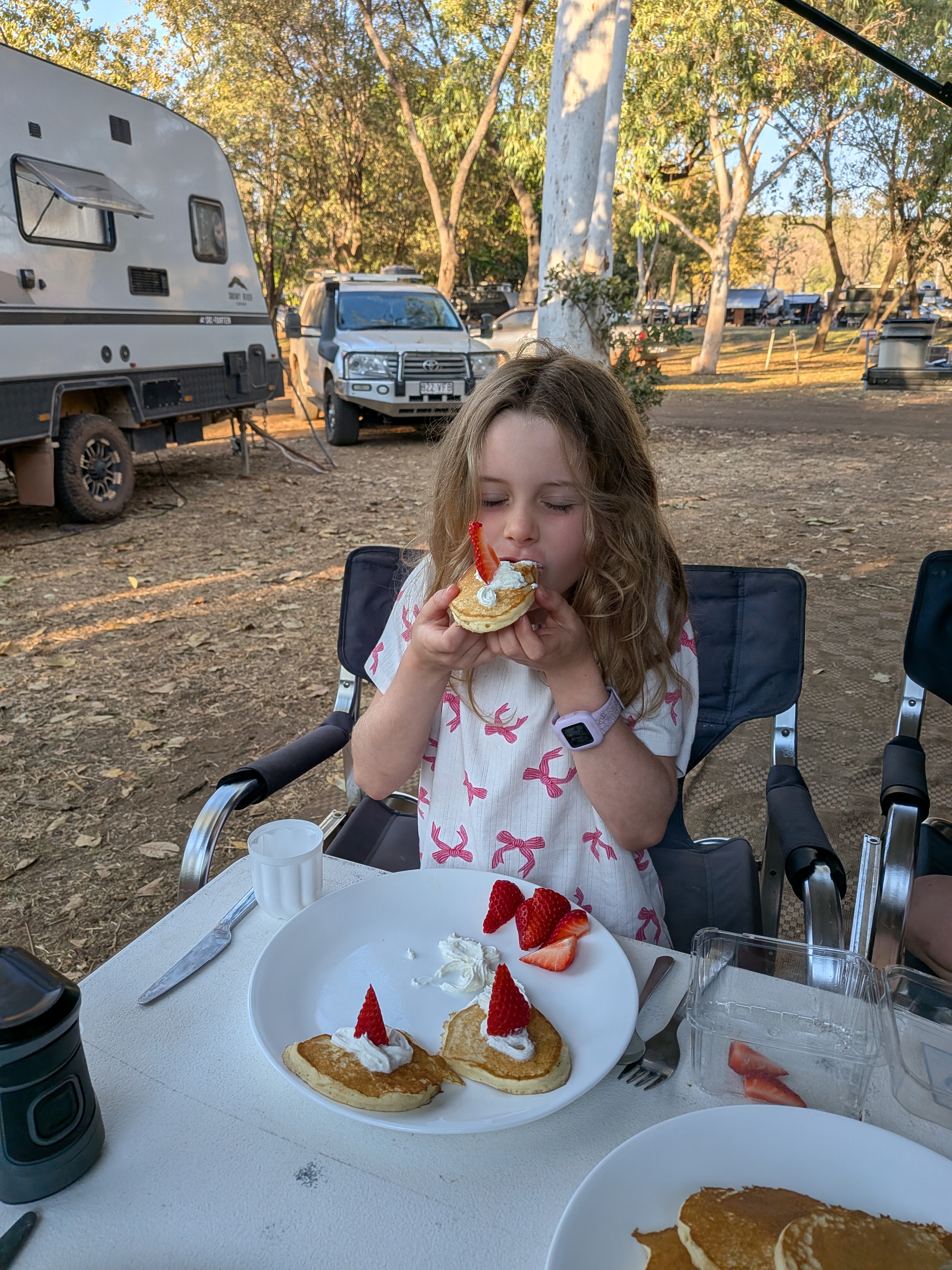 Pancakes with strawberries and cream for breakfast &mdash; Hazel approves