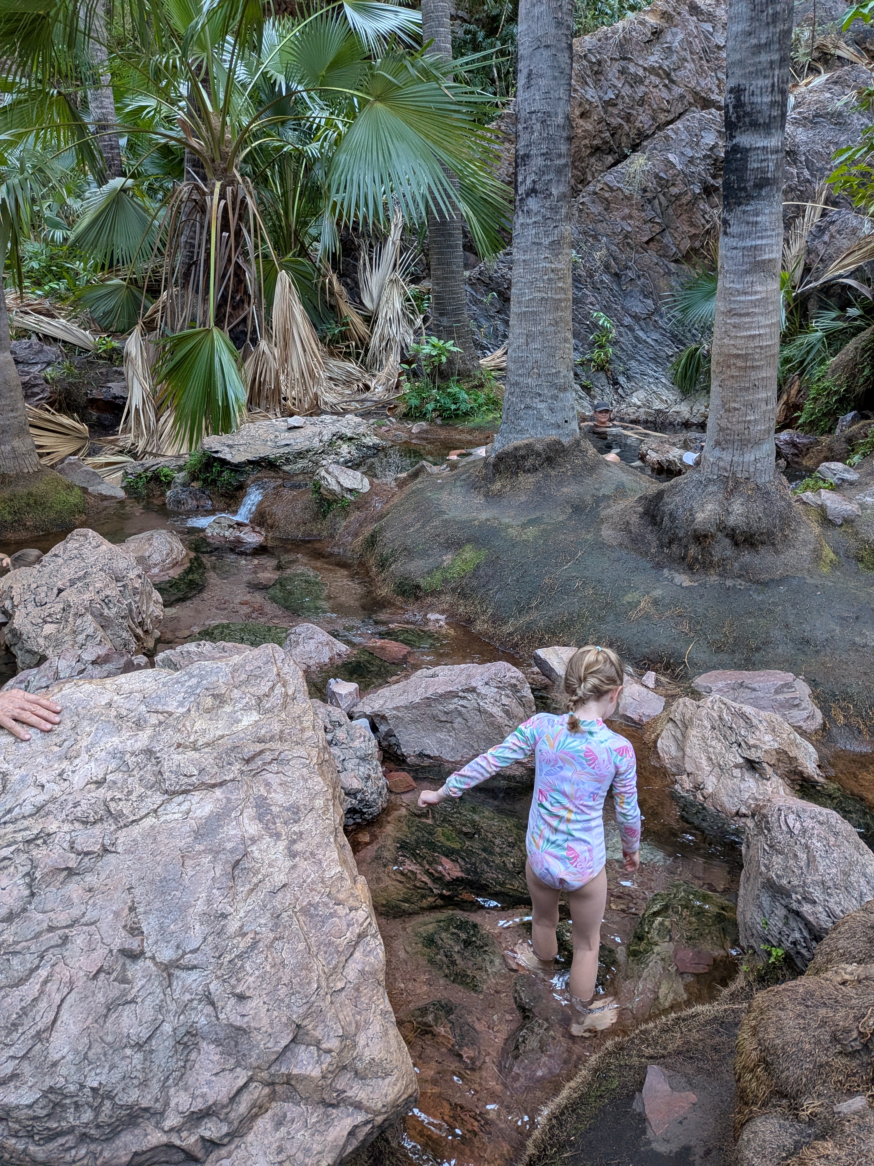 Hazel hopping between the little thermal pools, hunting for the best spot
